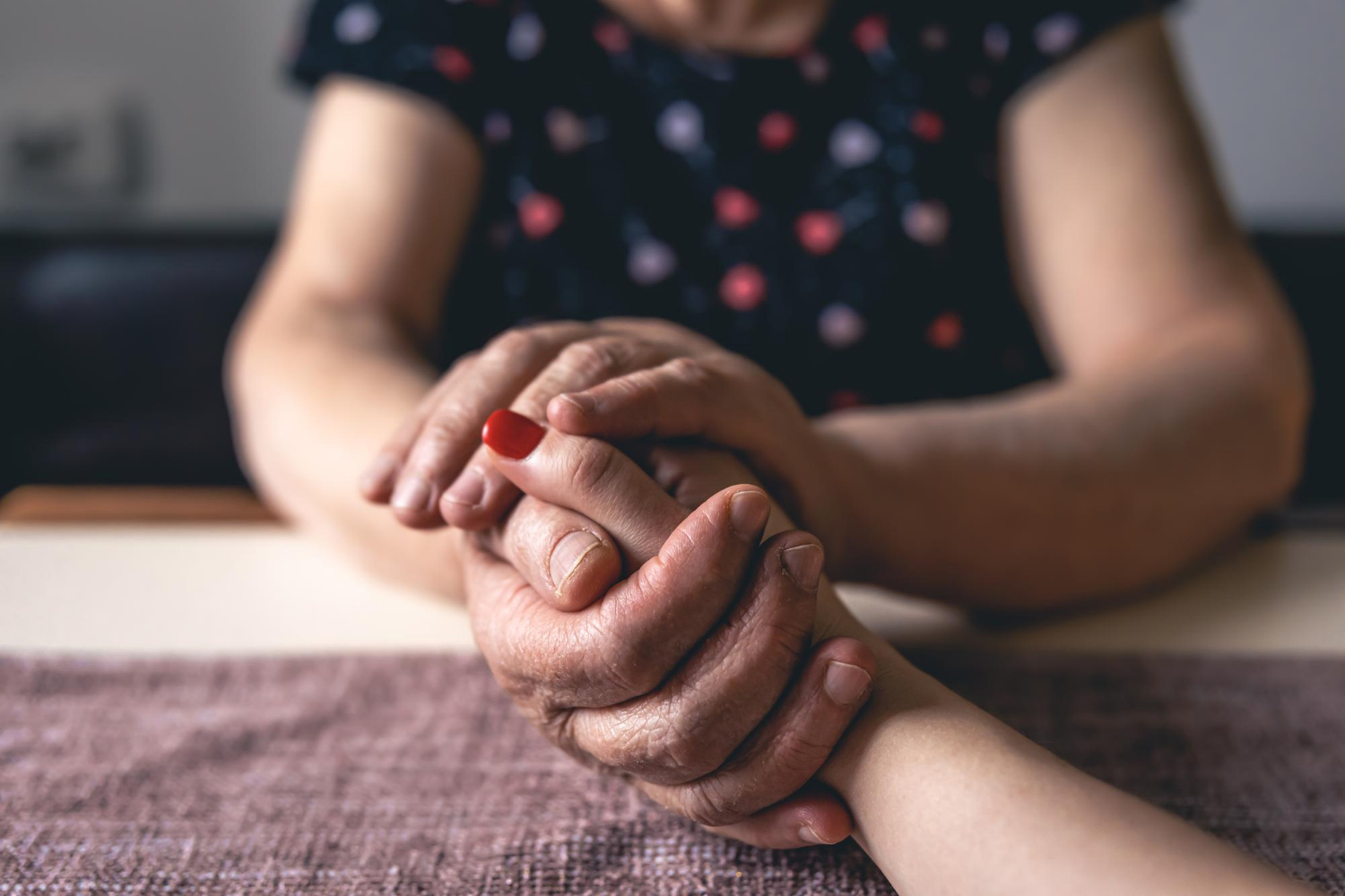 An older woman holding a young lady's hand | Source: Freepik