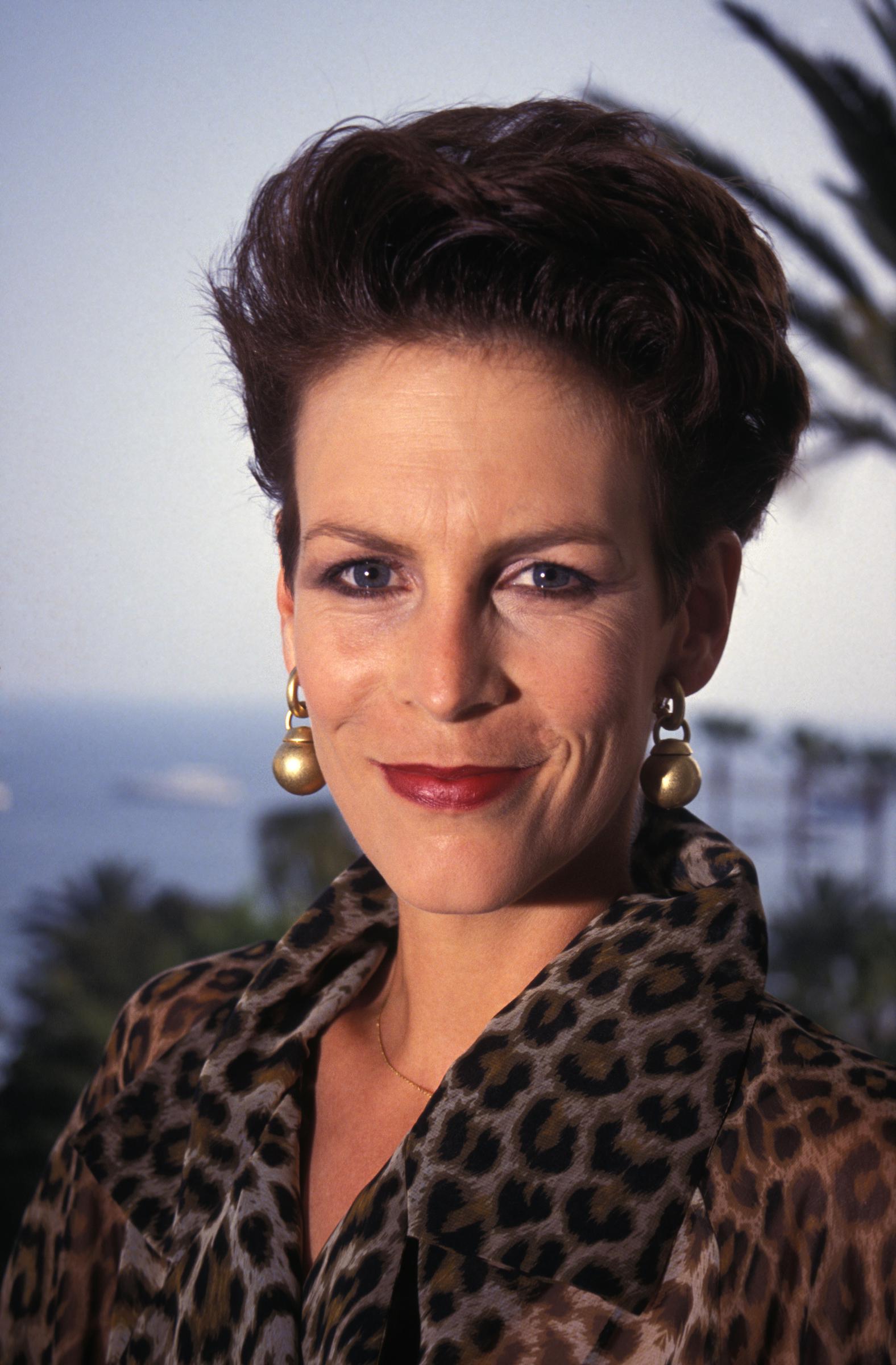 Curtis, who turned 34 in 1992, carried a bold, confident edge that defined early-'90s style. With sculpted cheekbones, short swept-back hair, and a leopard-print blouse, she radiated power and charisma. Her look was unapologetically sharp — a reflection of a woman who knew exactly who she was and wasn't afraid to show it.