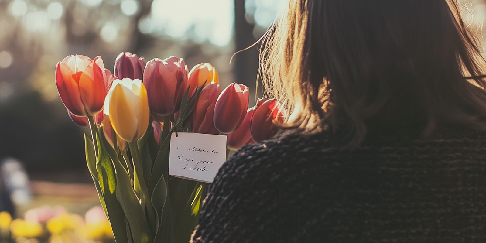 Woman with flowers. | Source: Midjourney