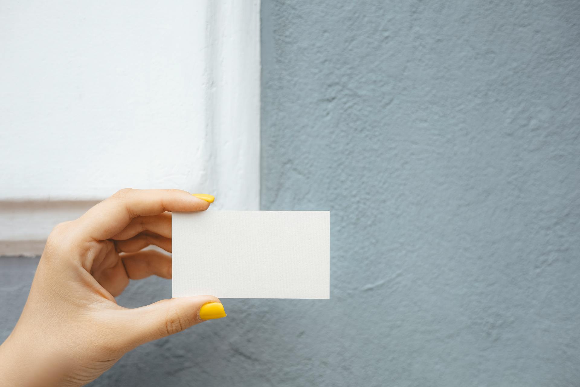Close-up shot of a woman holding a piece of paper | Source: Pexels