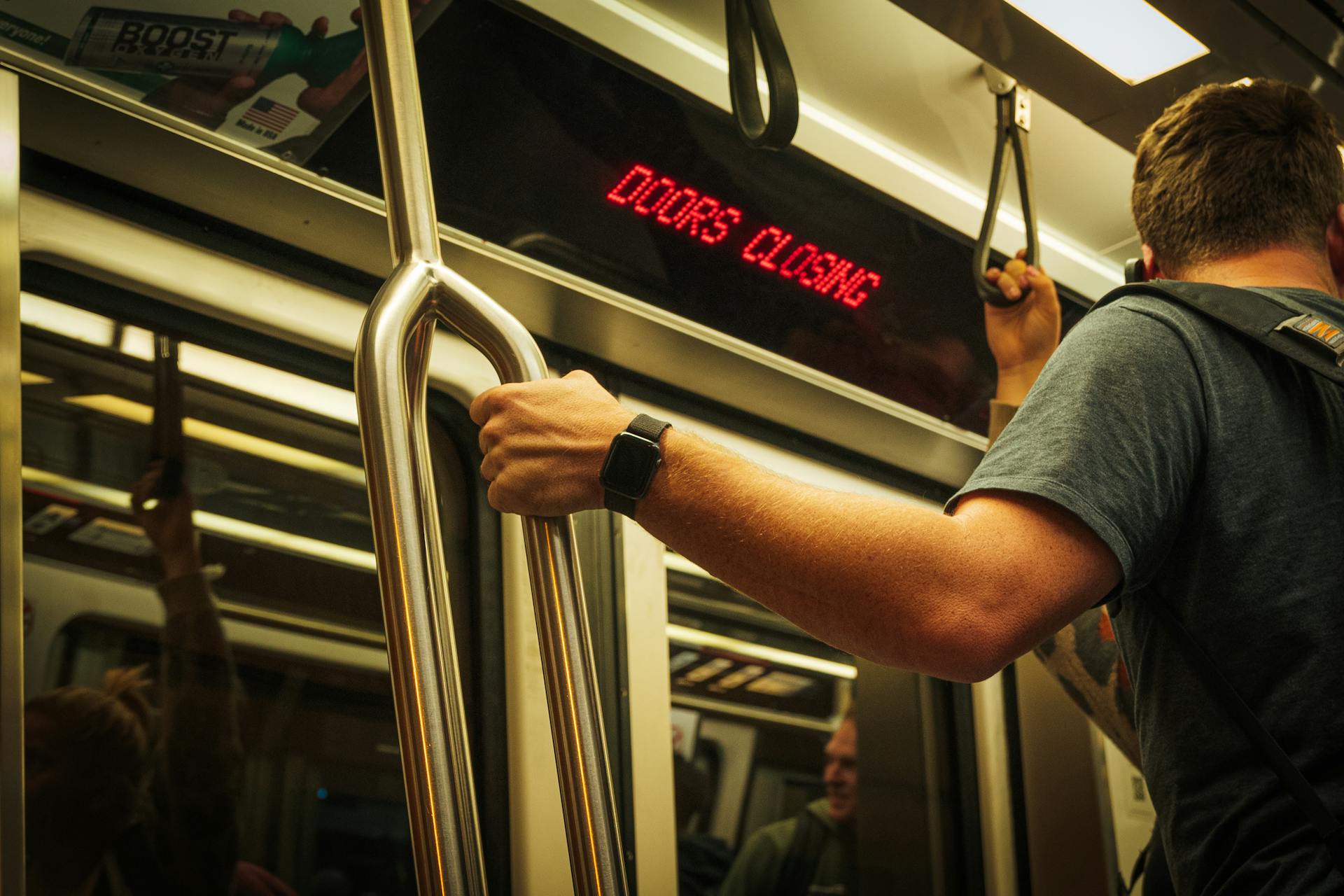 A young man standing on a subway | Source: Pexels