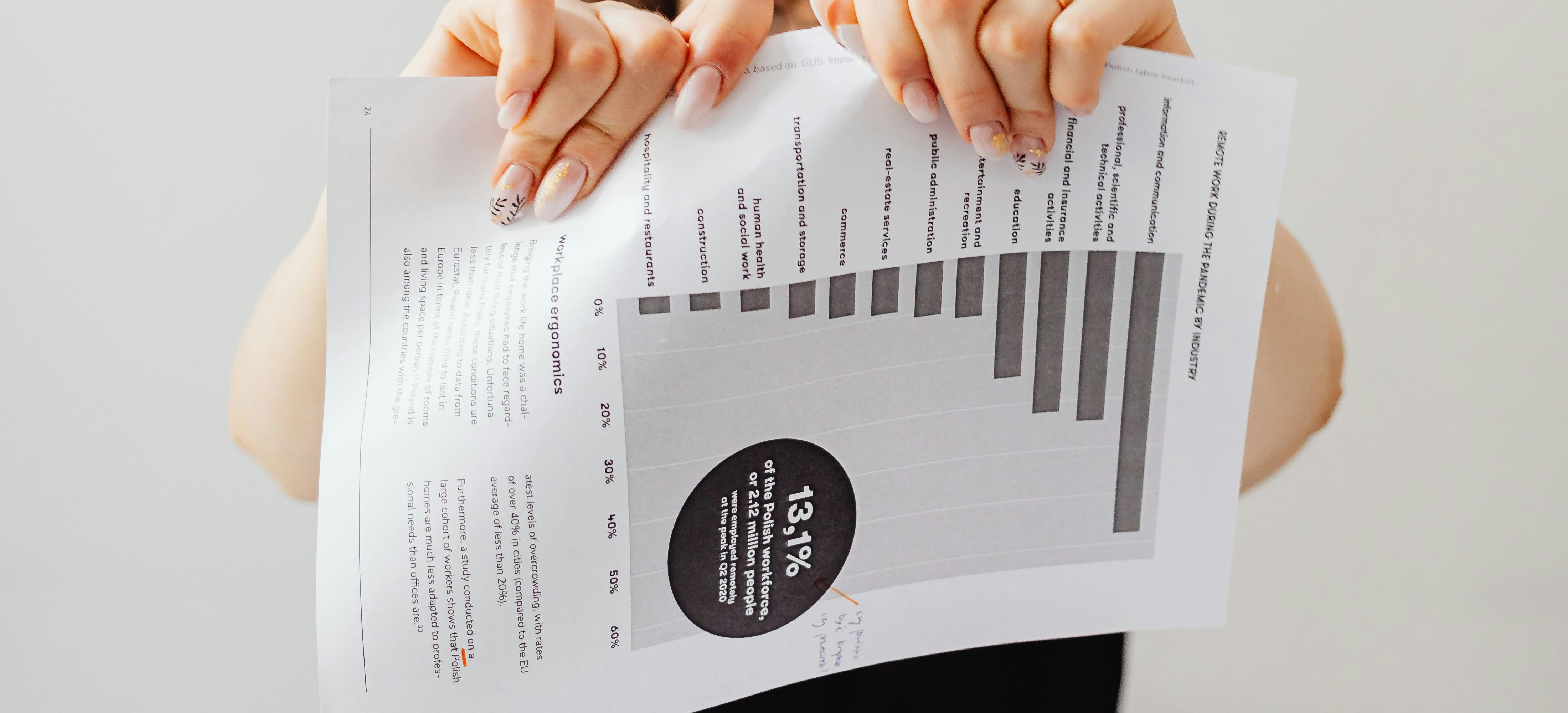 A person's hands ripping a piece of paper | Source: Pexels