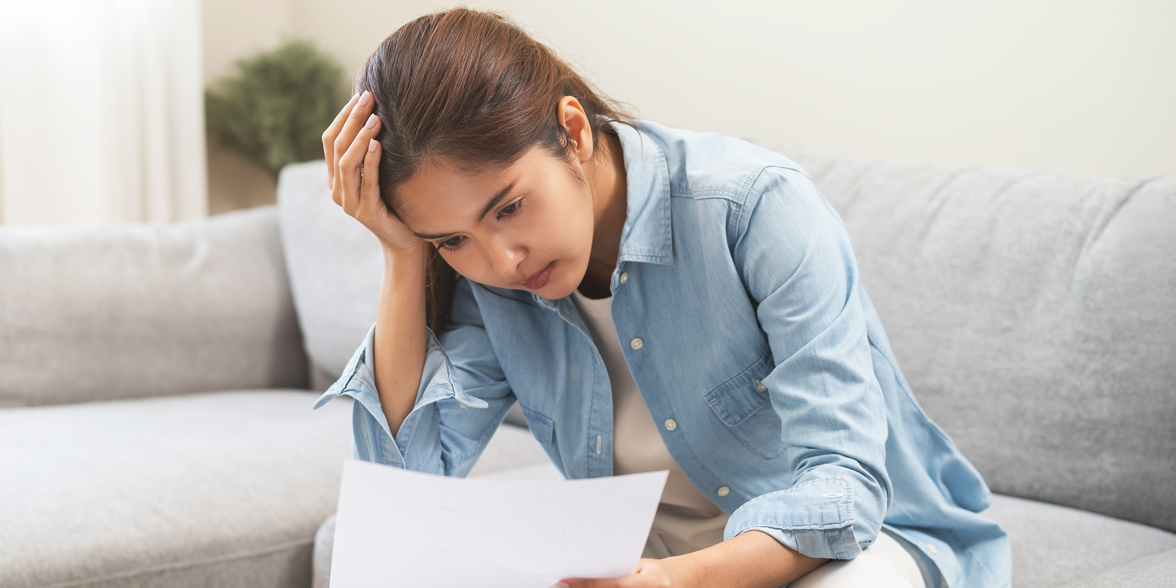 A woman looking at a document | Source: Shutterstock