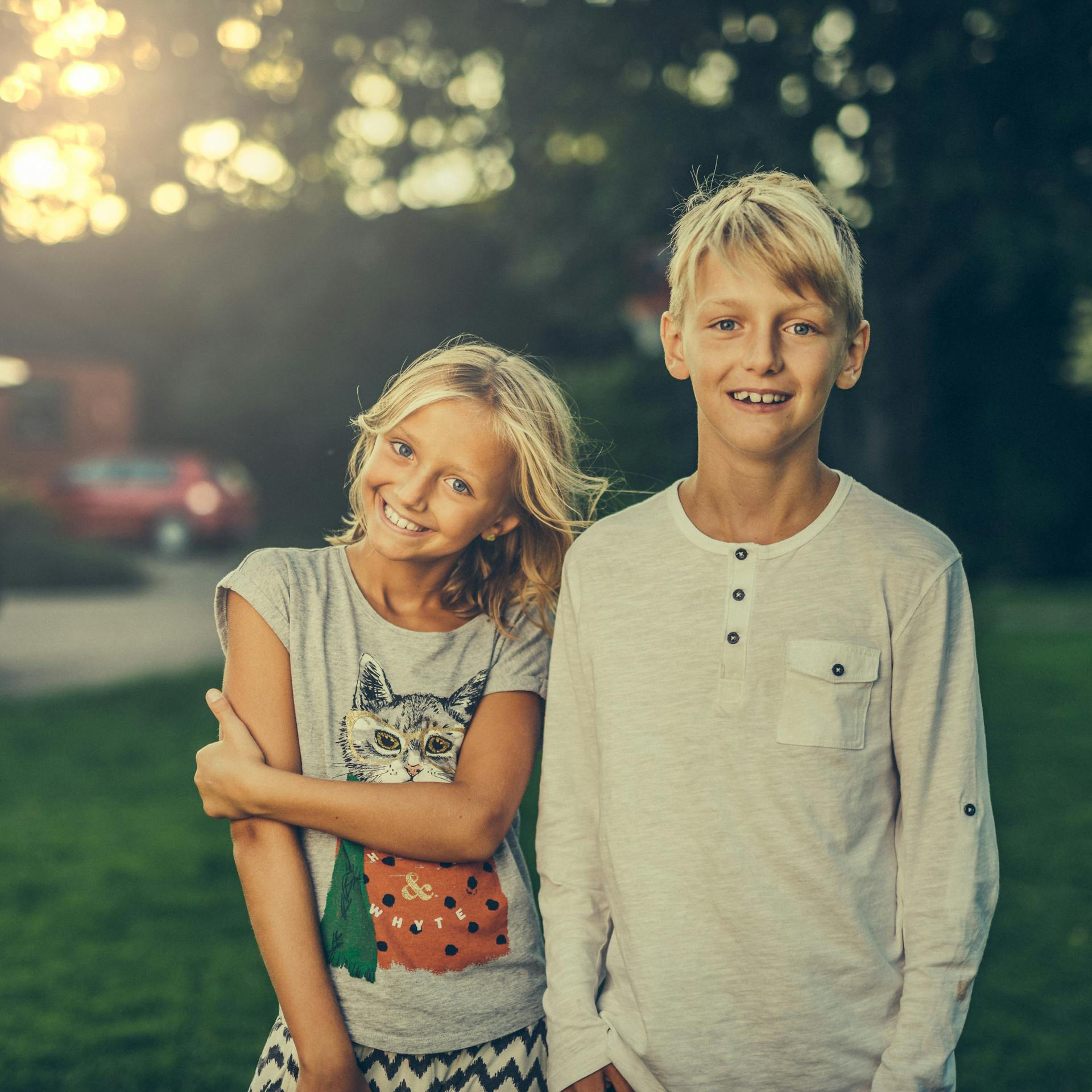 Two children standing in a park | Source: Pexels