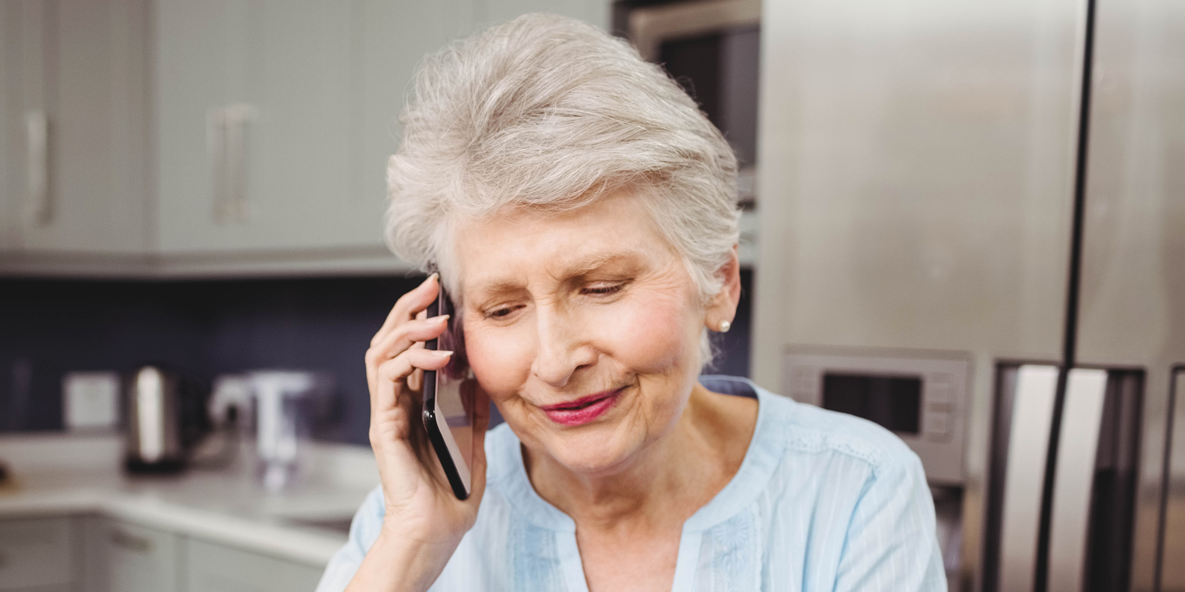 An older woman talking on the phone | Source: Shutterstock