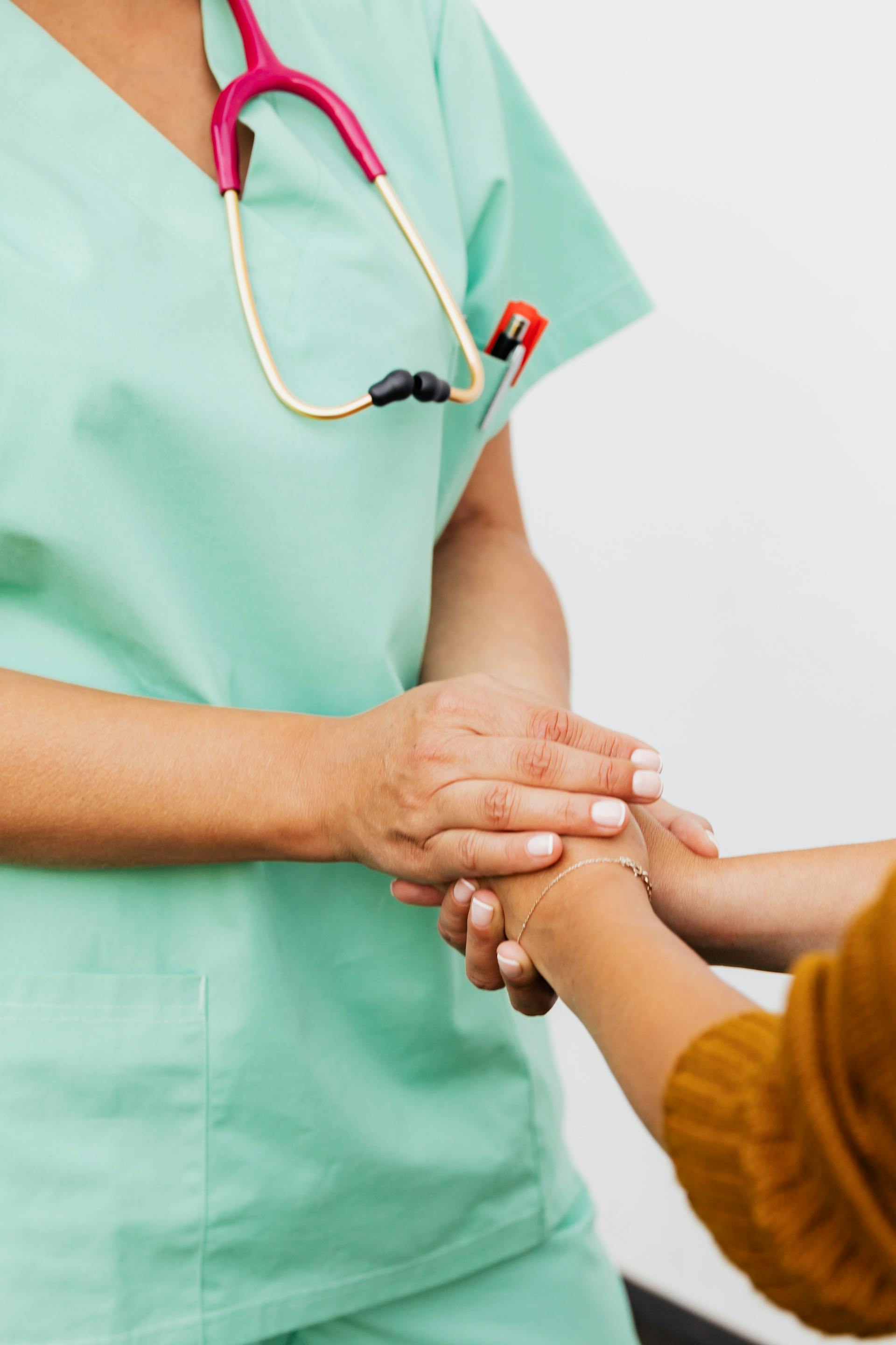 A nurse comforting a patient | Source: Pexels