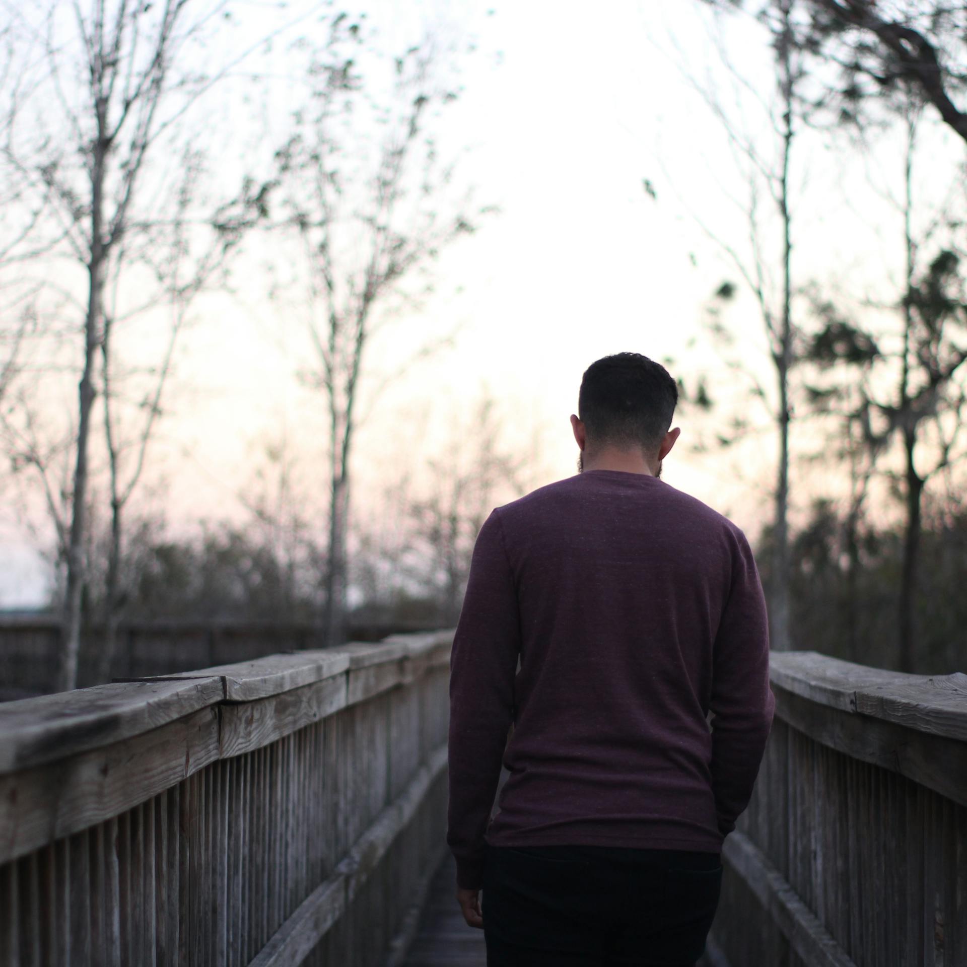 A back view shot of a man walking away | Source: Pexels