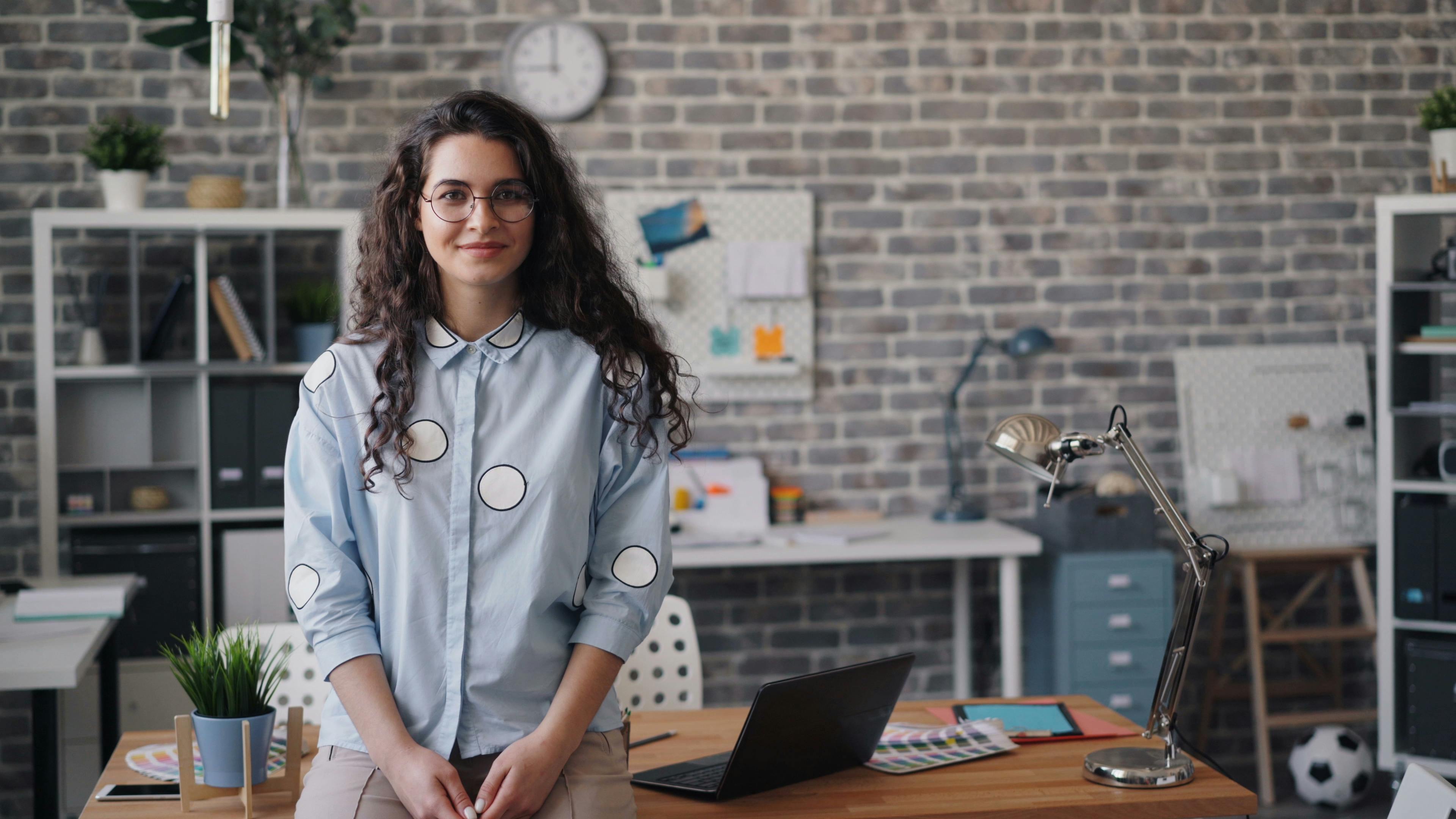 Young woman in the office | Source: Pexels