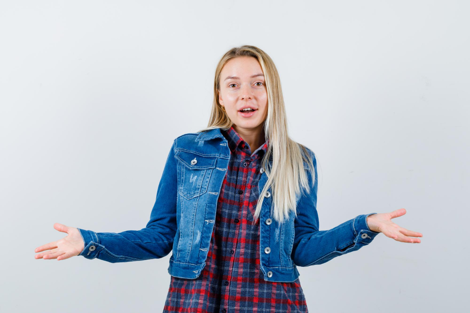 A woman shrugging indifferently | Source: Freepik