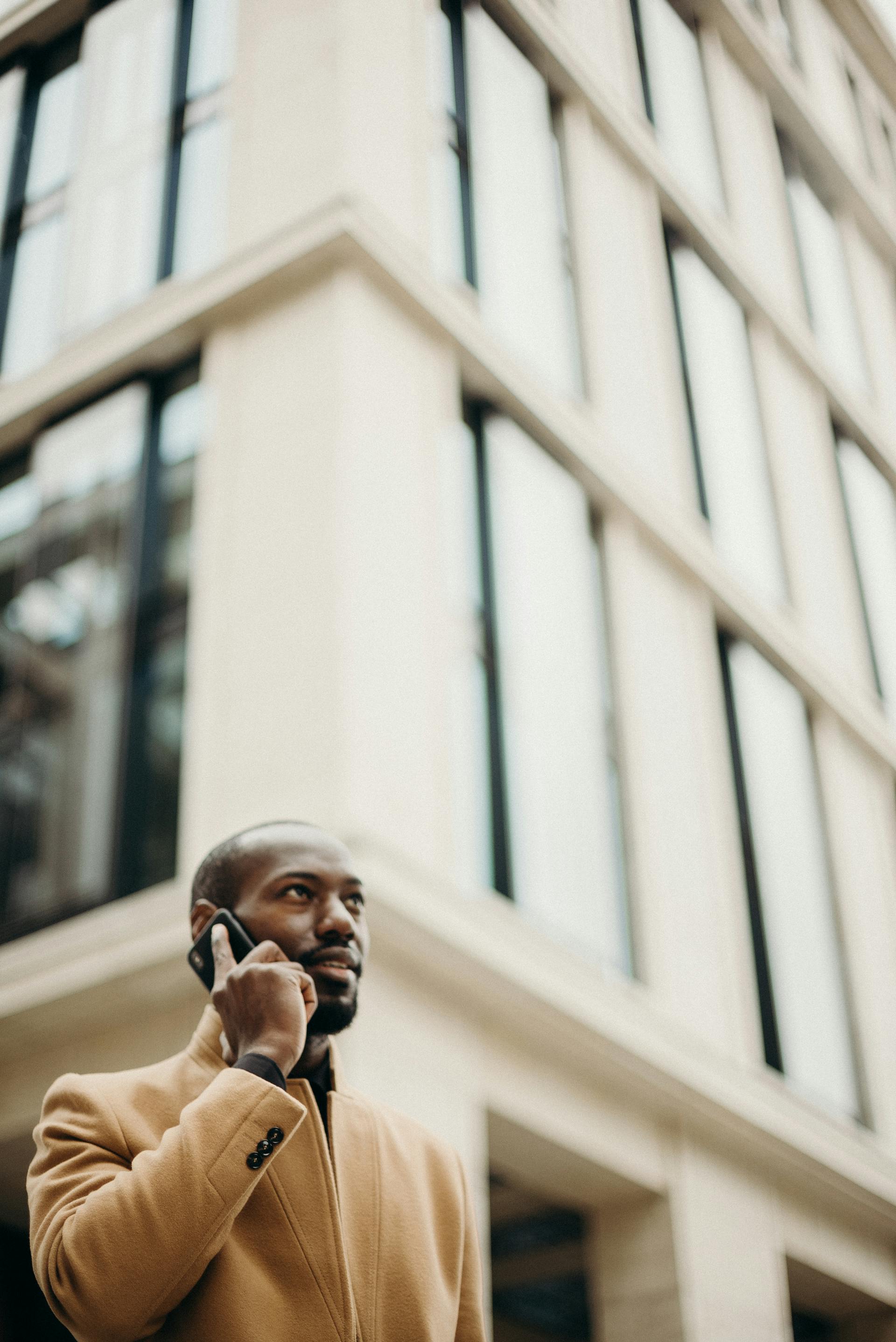 A thoughtful man speaking on his cell phone | Source: Pexels