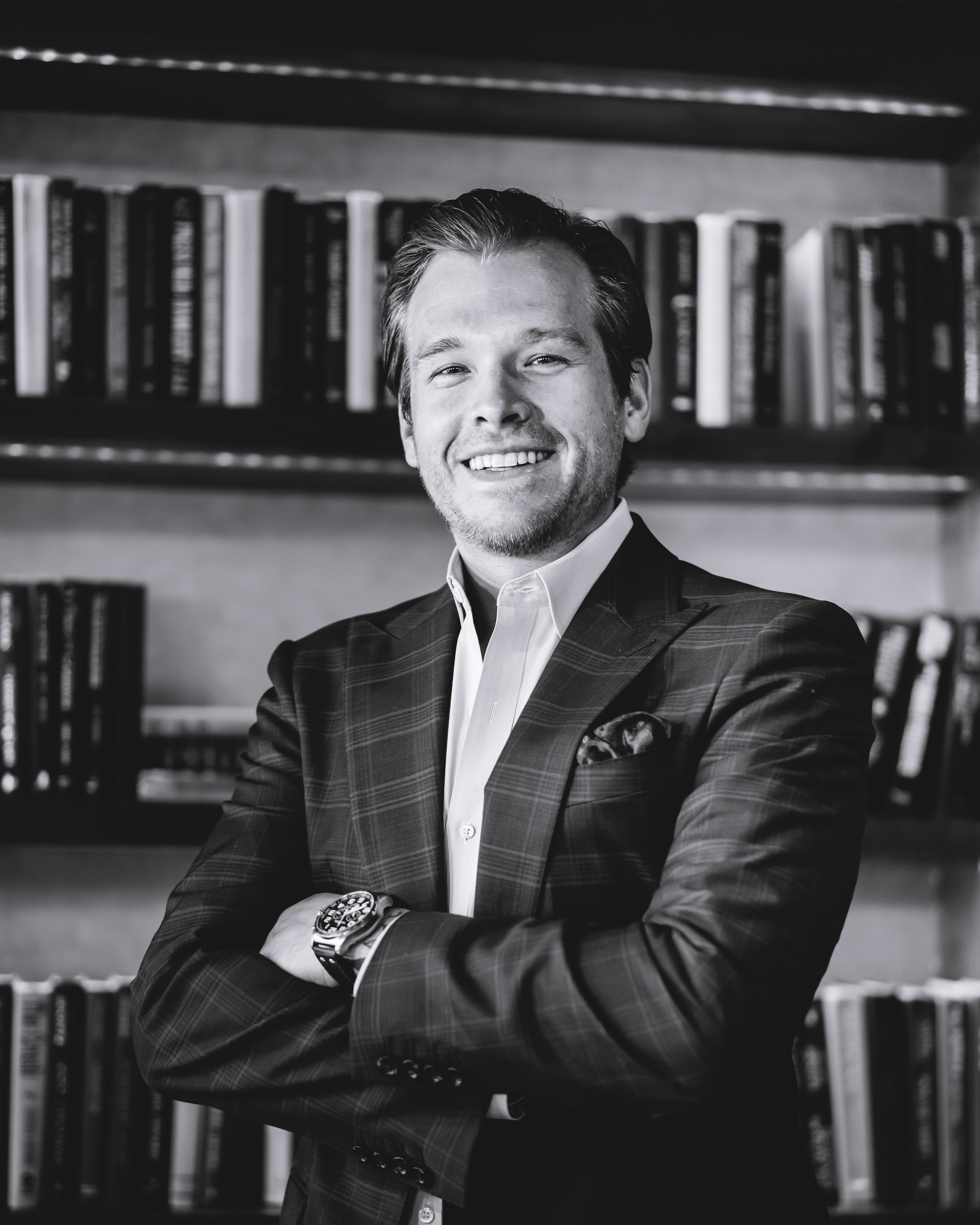 A smiling man wearing a suit | Source: Unsplash