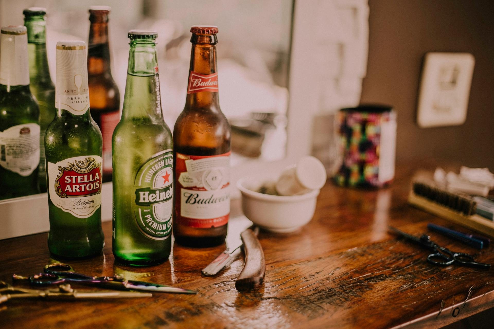Three bottles of beer lying on a table | Source: Pexels