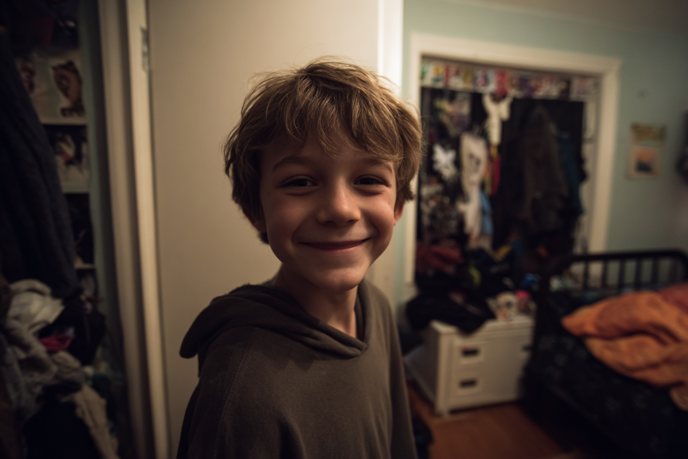 A boy smiling | Source: Midjourney