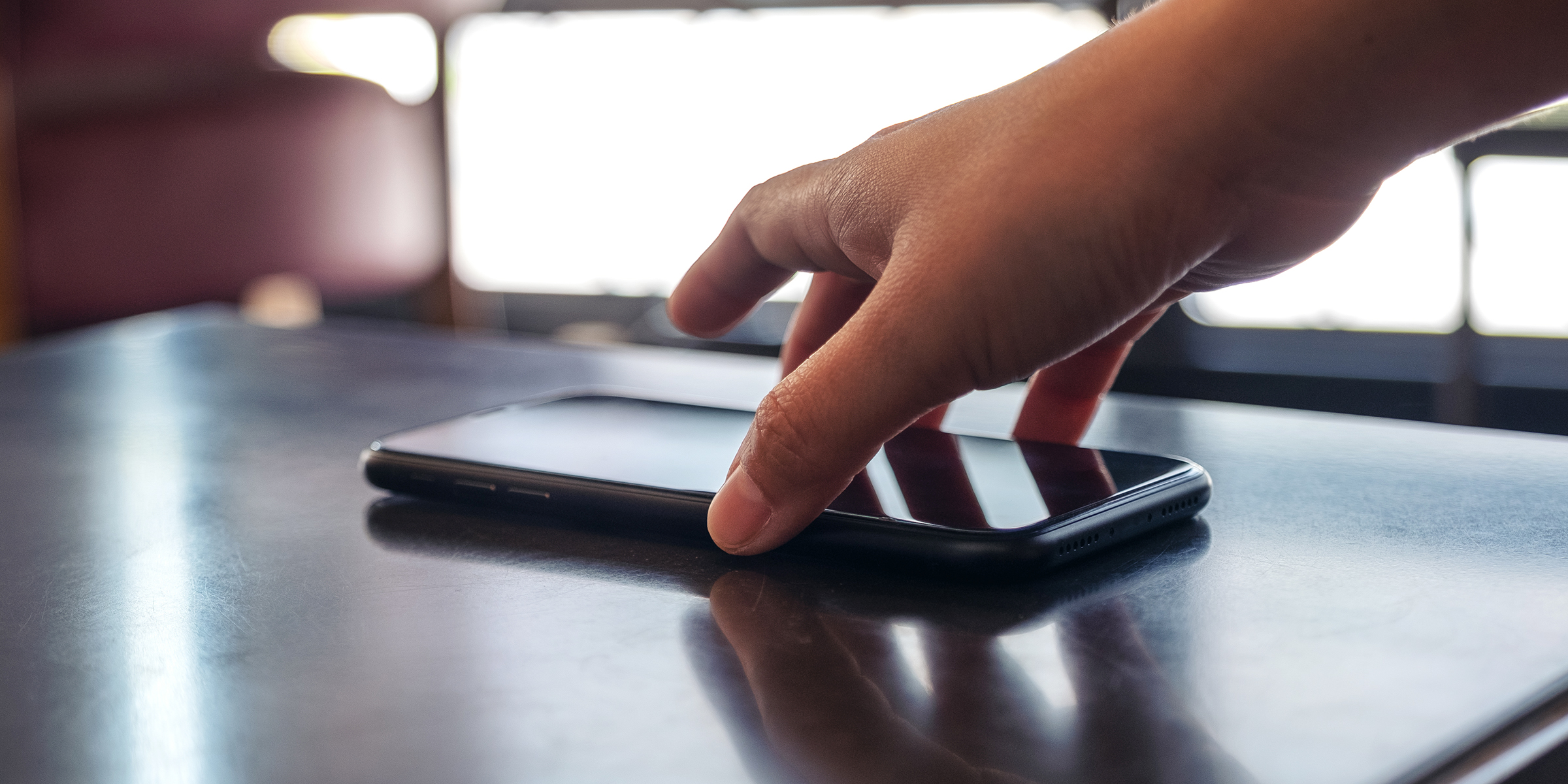 A person picking up a phone | Source: Shutterstock