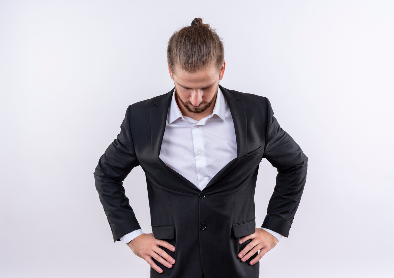 A bothered man in an elegant suit | Source: Freepik