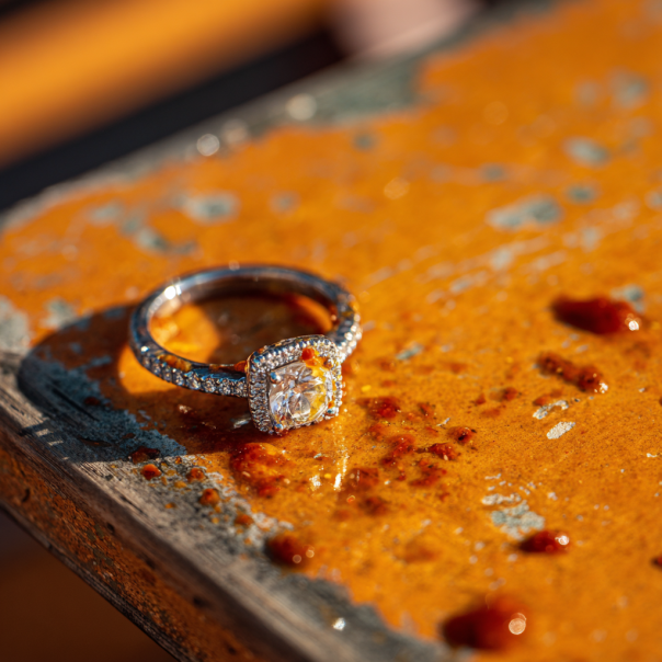 An engagement ring covered with mild sauce | Source: Midjourney
