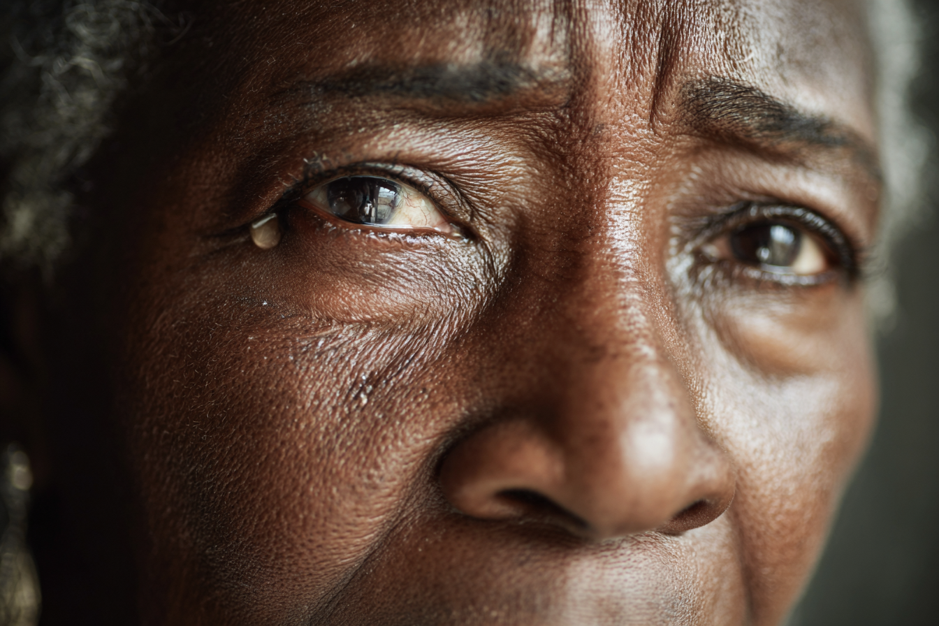 An woman with tears in her eyes | Source: Midjourney