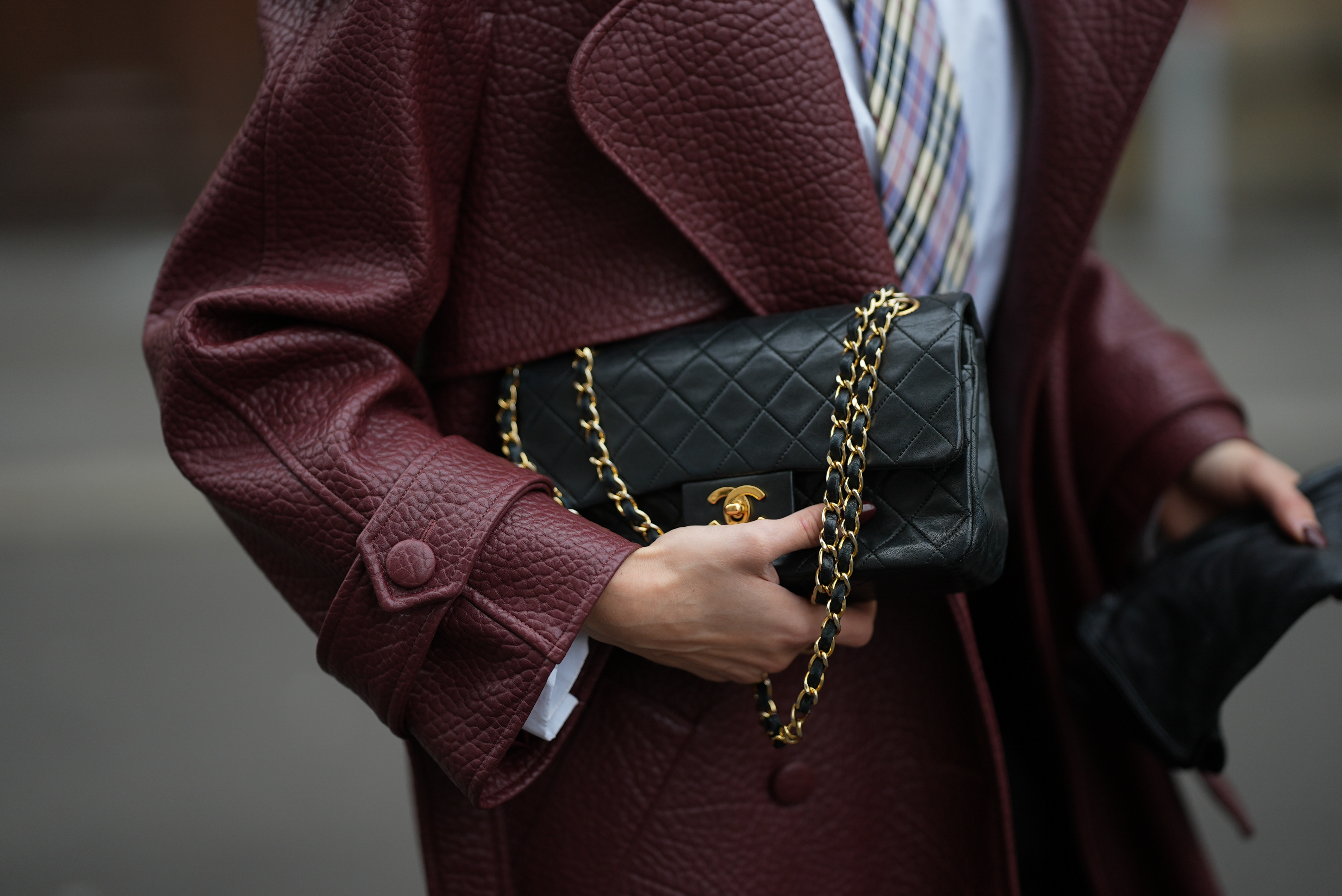 Lisa Mottl is seen wearing a small classic black quilted vintage Chanel flap bag on December 2, 2025 in Berlin, Germany. | Source: Getty Images