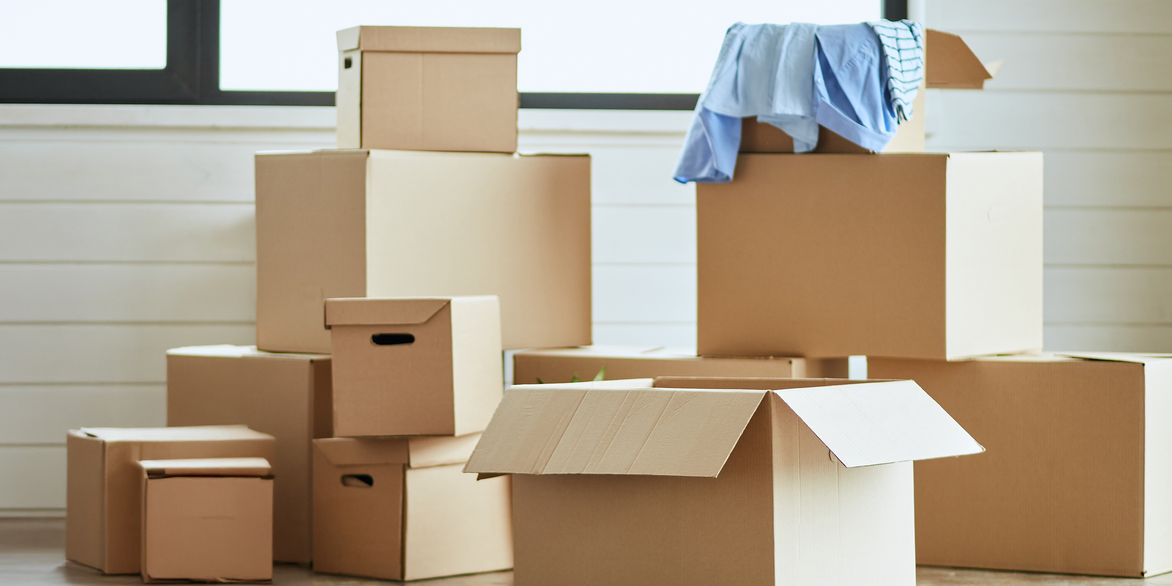 Cardboard boxes in a house | Source: Shutterstock