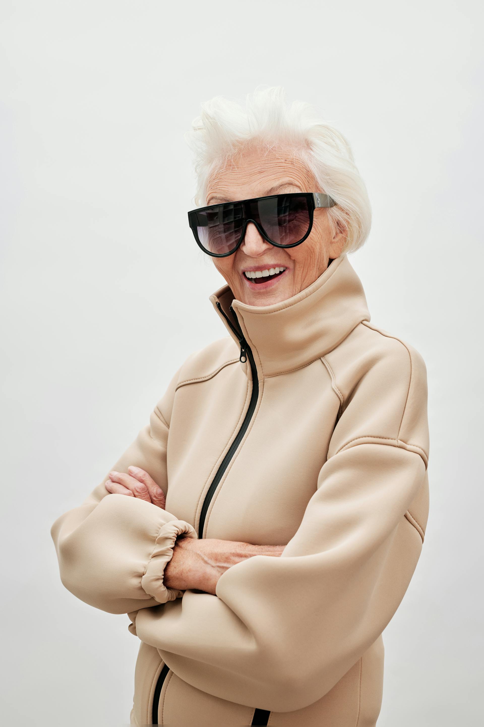 An elderly woman laughing | Source: Pexels