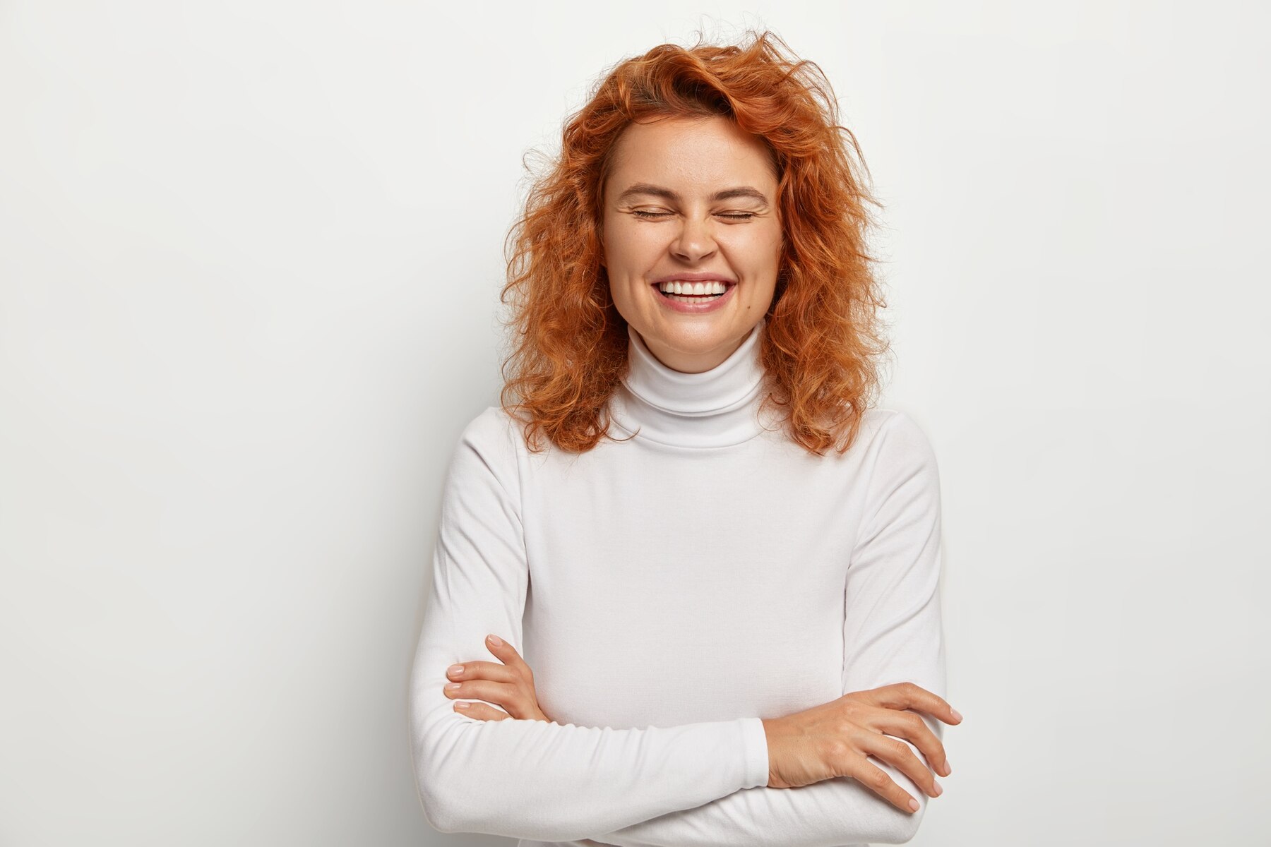 A laughing redhead | Source: Freepik