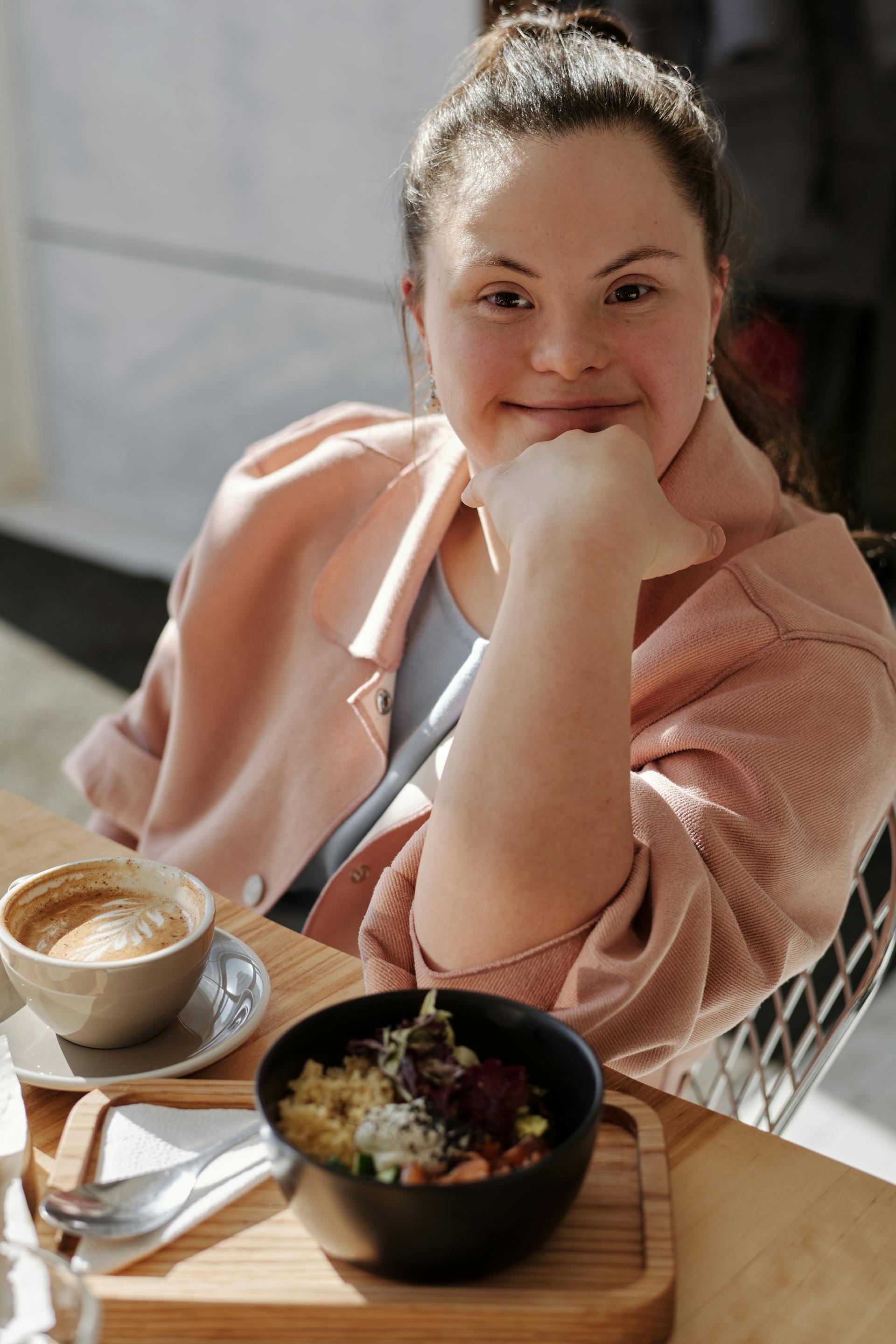 A smiling young woman with Down syndrome | Source: Pexels