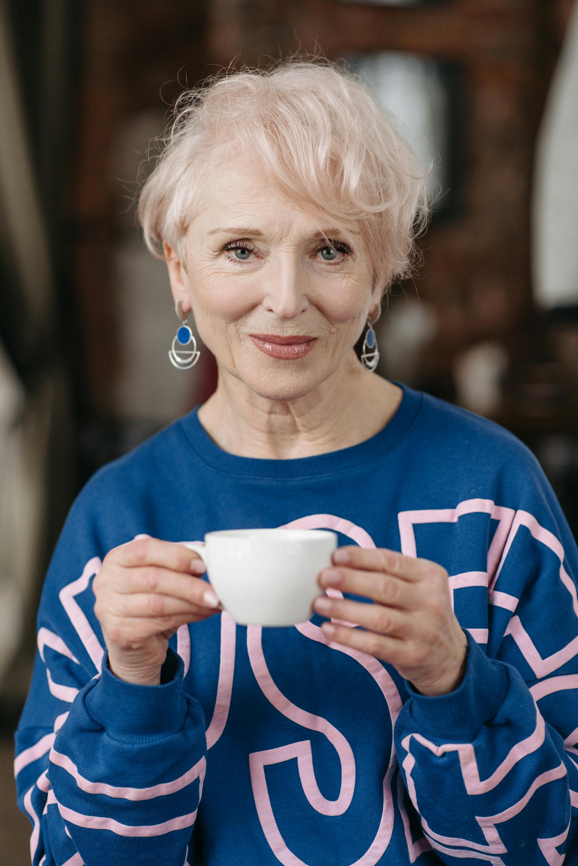 A senior woman holding a cup of tea | Source: Pexels
