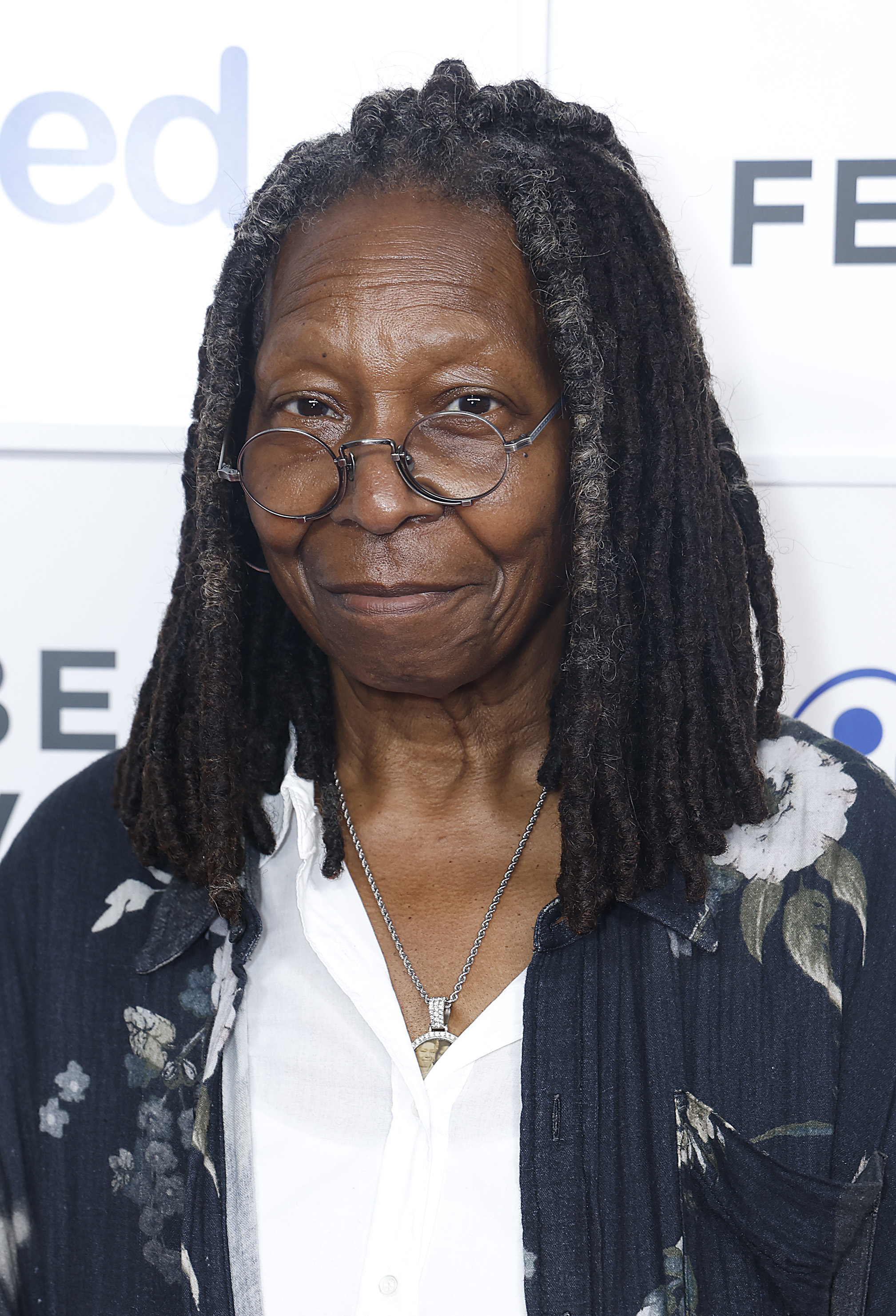 Goldberg, who also turned 69 in 2024, appeared at the Tribeca Festival in New York with her signature ease and authenticity. Dressed in a floral-print cardigan over a crisp white shirt, and framed by long locs and round glasses, she embraced comfort without sacrificing individuality — leaning into a look that felt lived-in, grounded, and unmistakably her own.