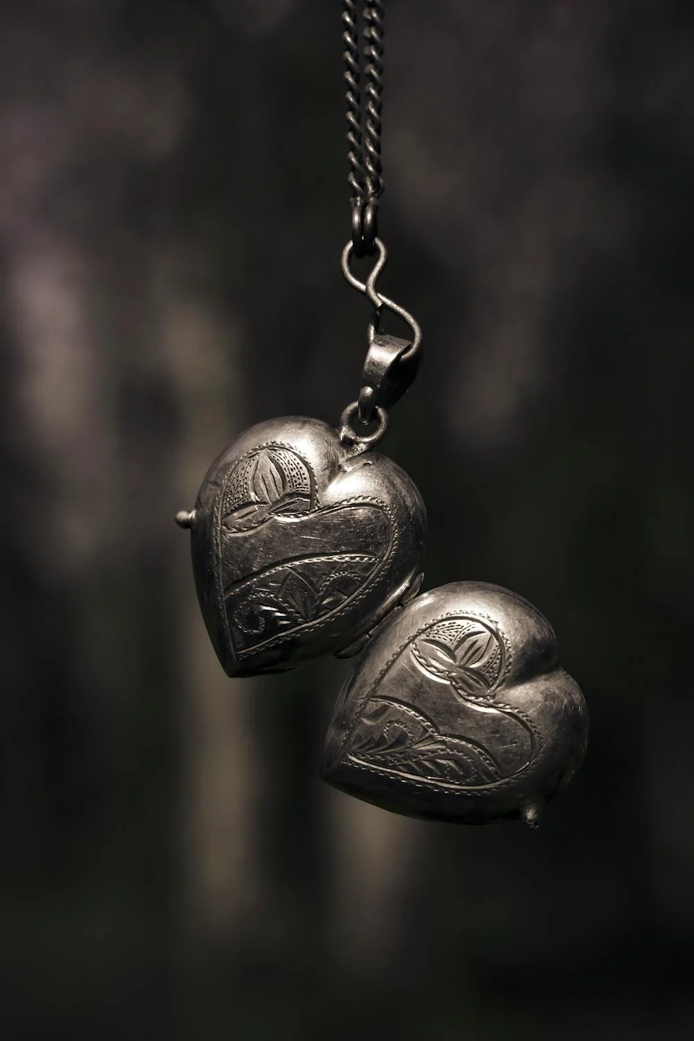 Holding a heart-shaped locket | Source: Pexels