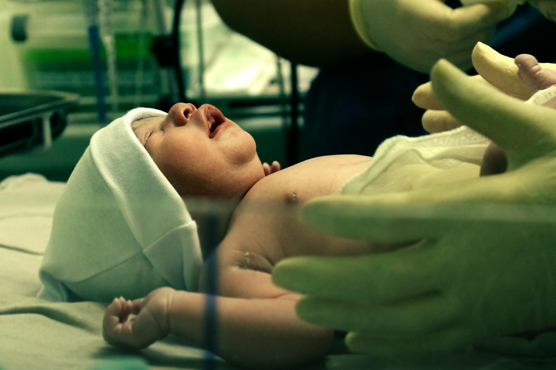 A baby being checked after delivery | Source: Pexels