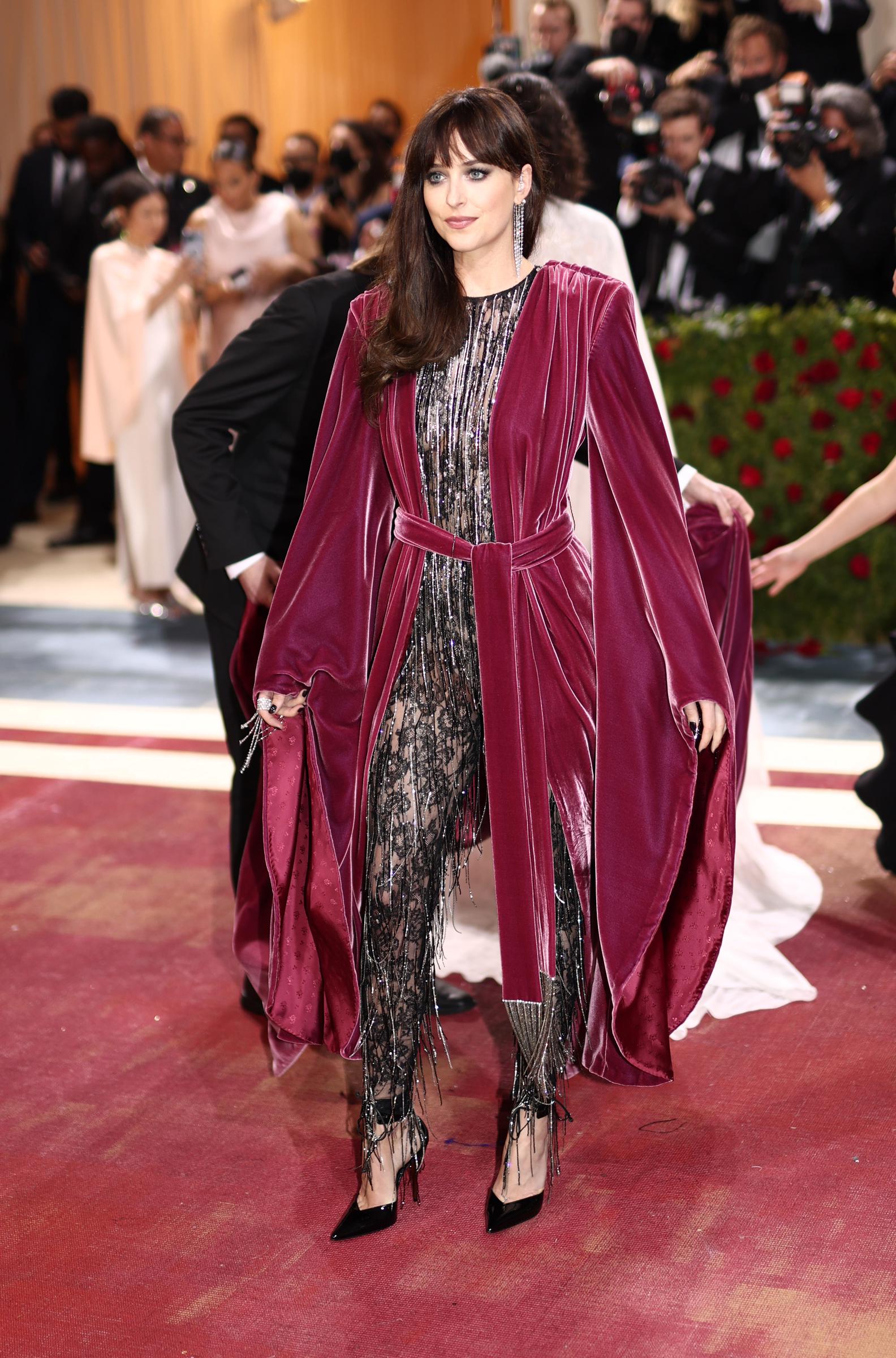 Dakota Johnson in a Gucci catsuit and cape at the 2022 Met Gala on May 2, 2022 in New York City | Source: Getty Images