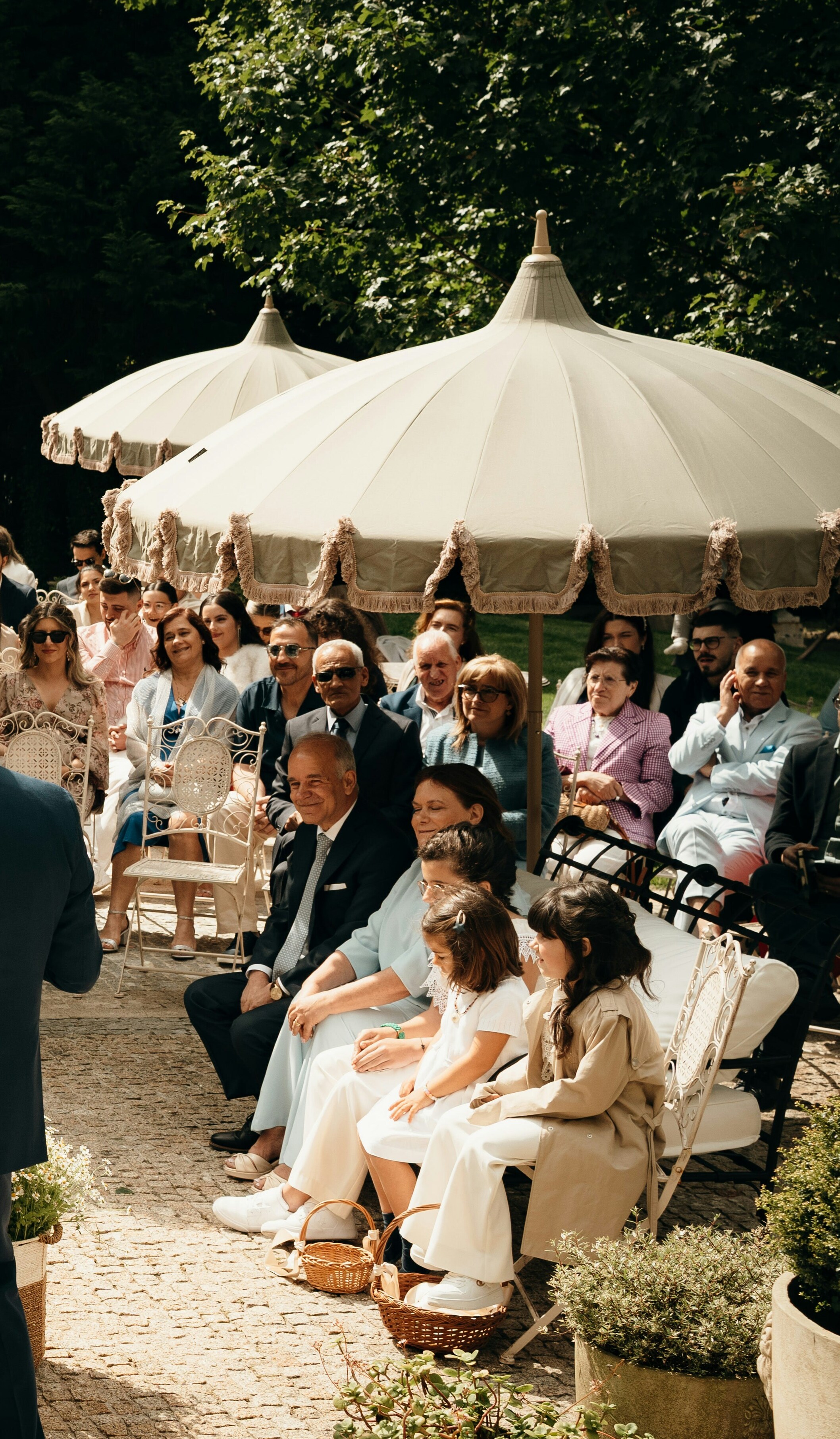 Guests attending an outdoor wedding ceremony | Source: Unsplash