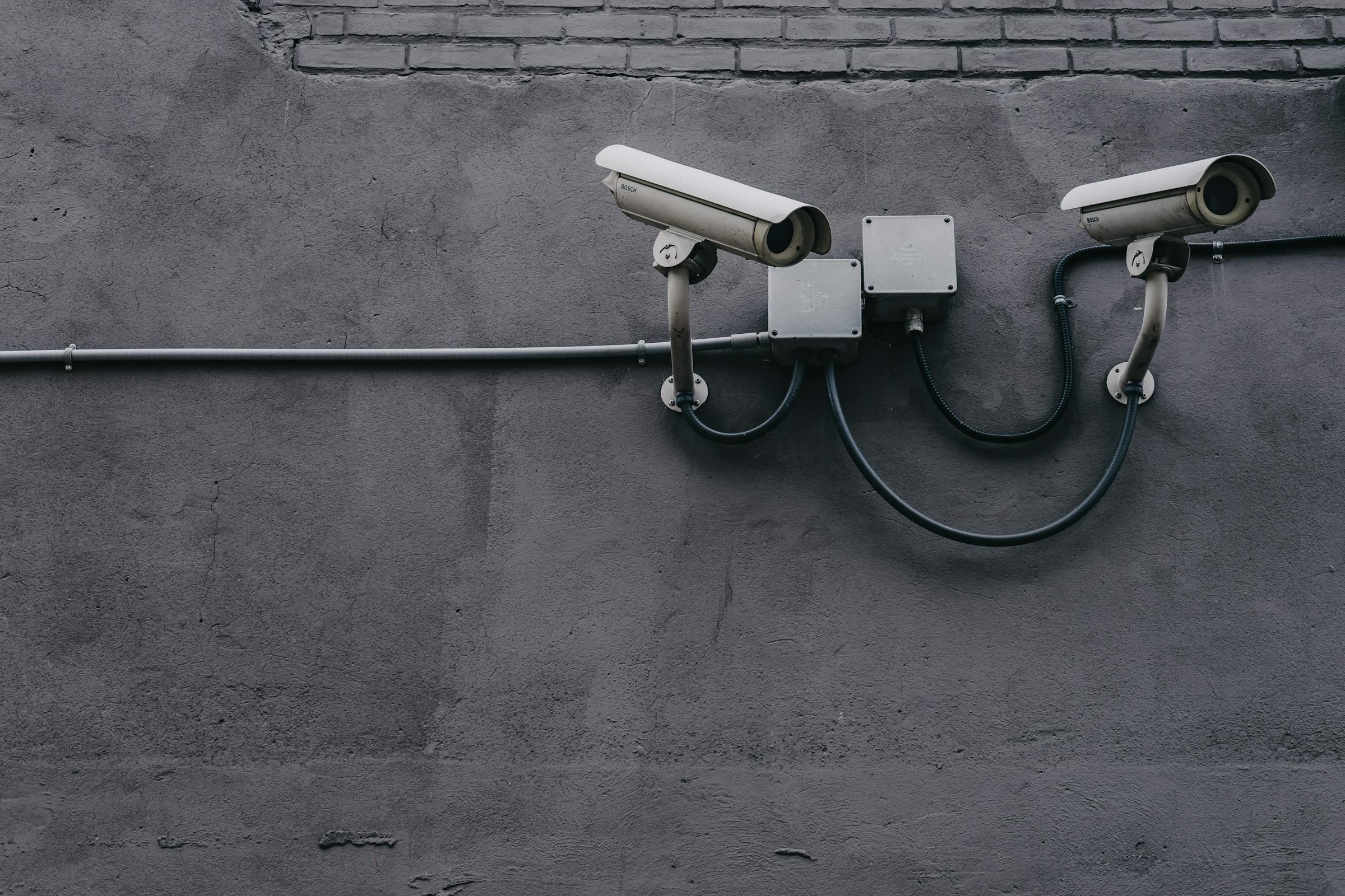 CCTV cameras mounted on a wall | Source: Pexels