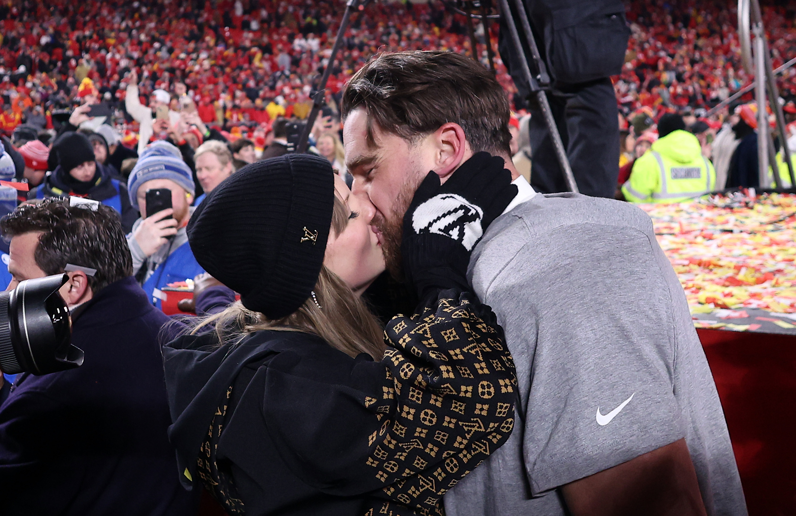 Taylor Swift kisses Travis Kelce during AFC Championship Game at GEHA Field at Arrowhead Stadium on January 26, 2025, in Kansas City, Missouri. | Source: Getty Images