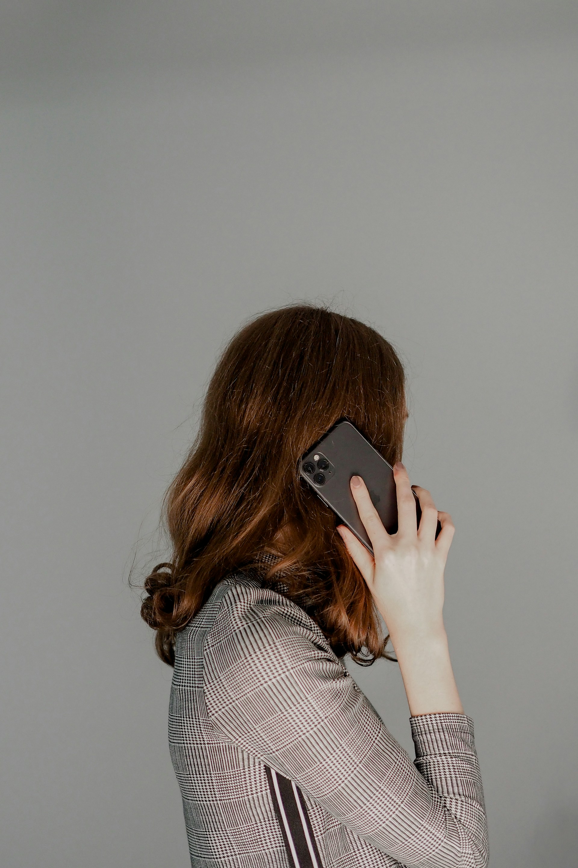 My Sister Excluded My Son from Her Wedding After He Made Her Dress, but Still Expected to Wear It – We Gave Her One Condition to Keep It 9 A woman engaged on a phonecall | Source: Unsplash