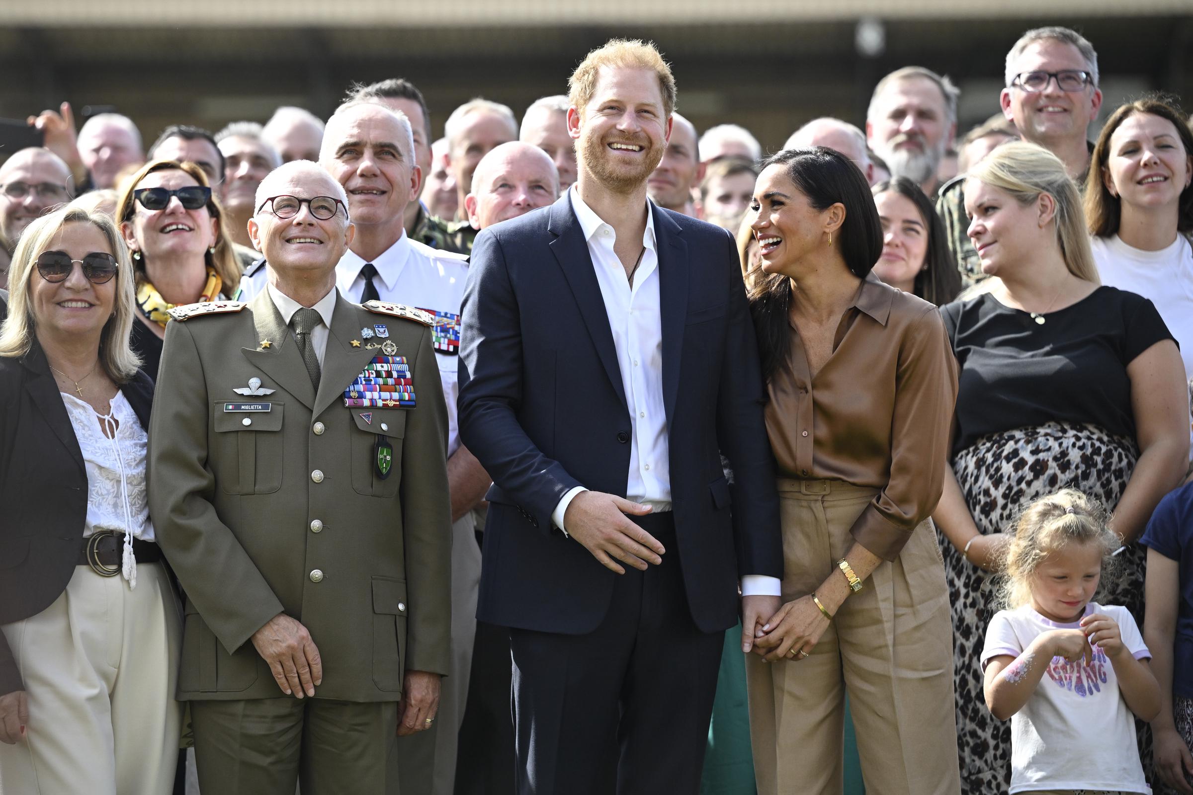 Prince Harry, Duke of Sussex and Meghan, Duchess of Sussex meeting with NATO Joint Force Command and families from Italy and Netherlands during day five of the Invictus Games Düsseldorf 2023 on September 14 in Germany. | Source: Getty Images