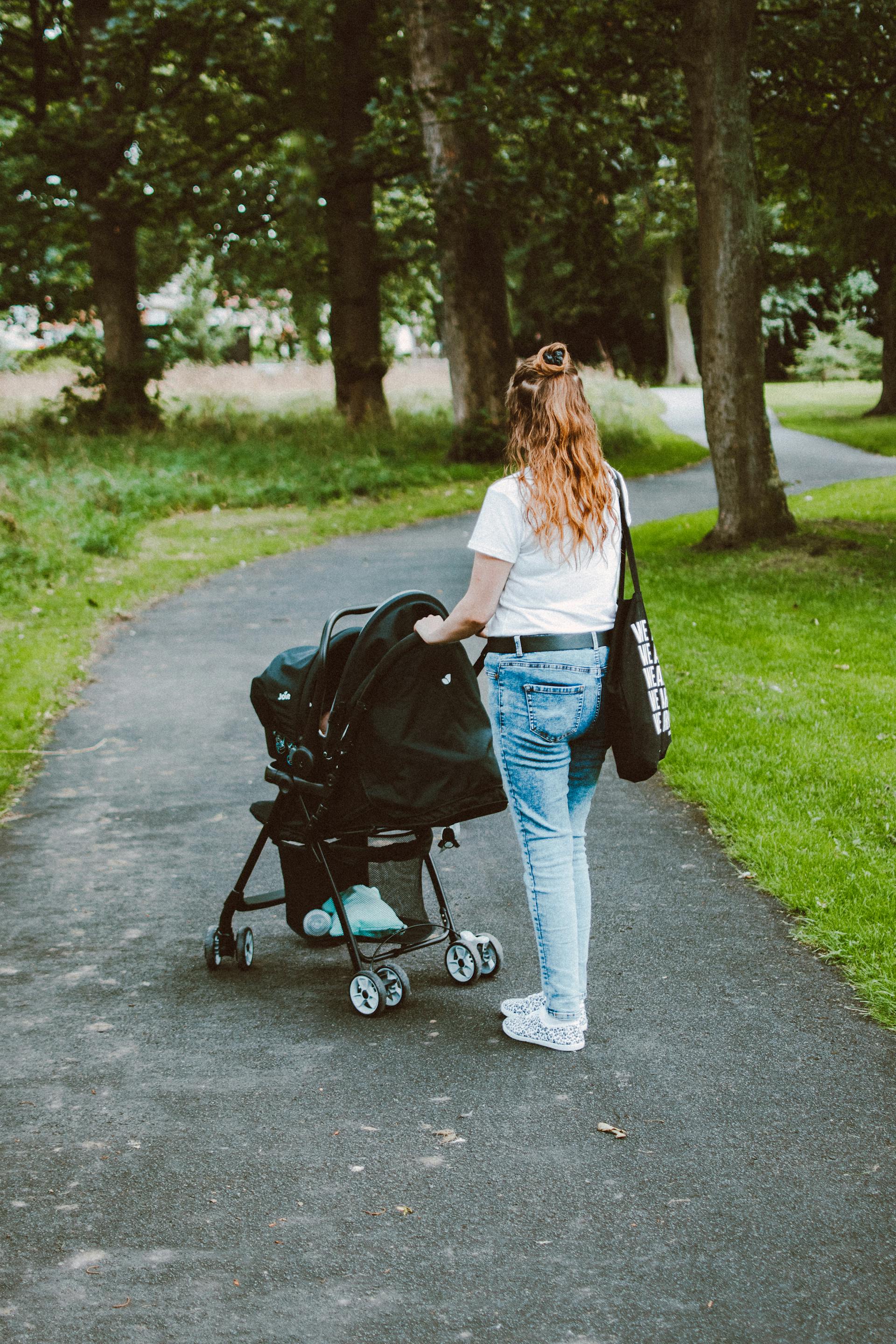 A woman standing with a stroller | Source: Pexels