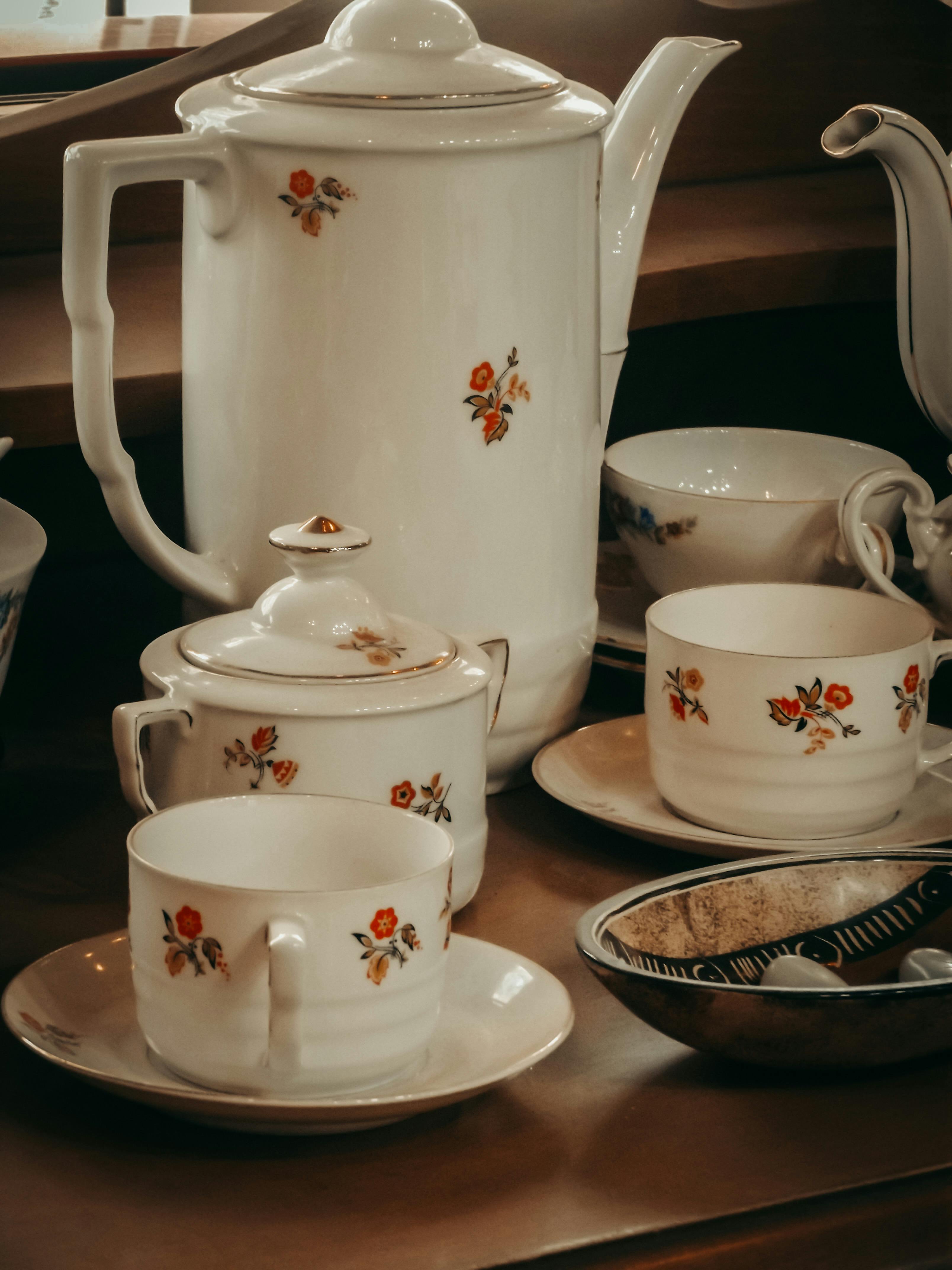 A white tea set with red flowers | Source: Pexels