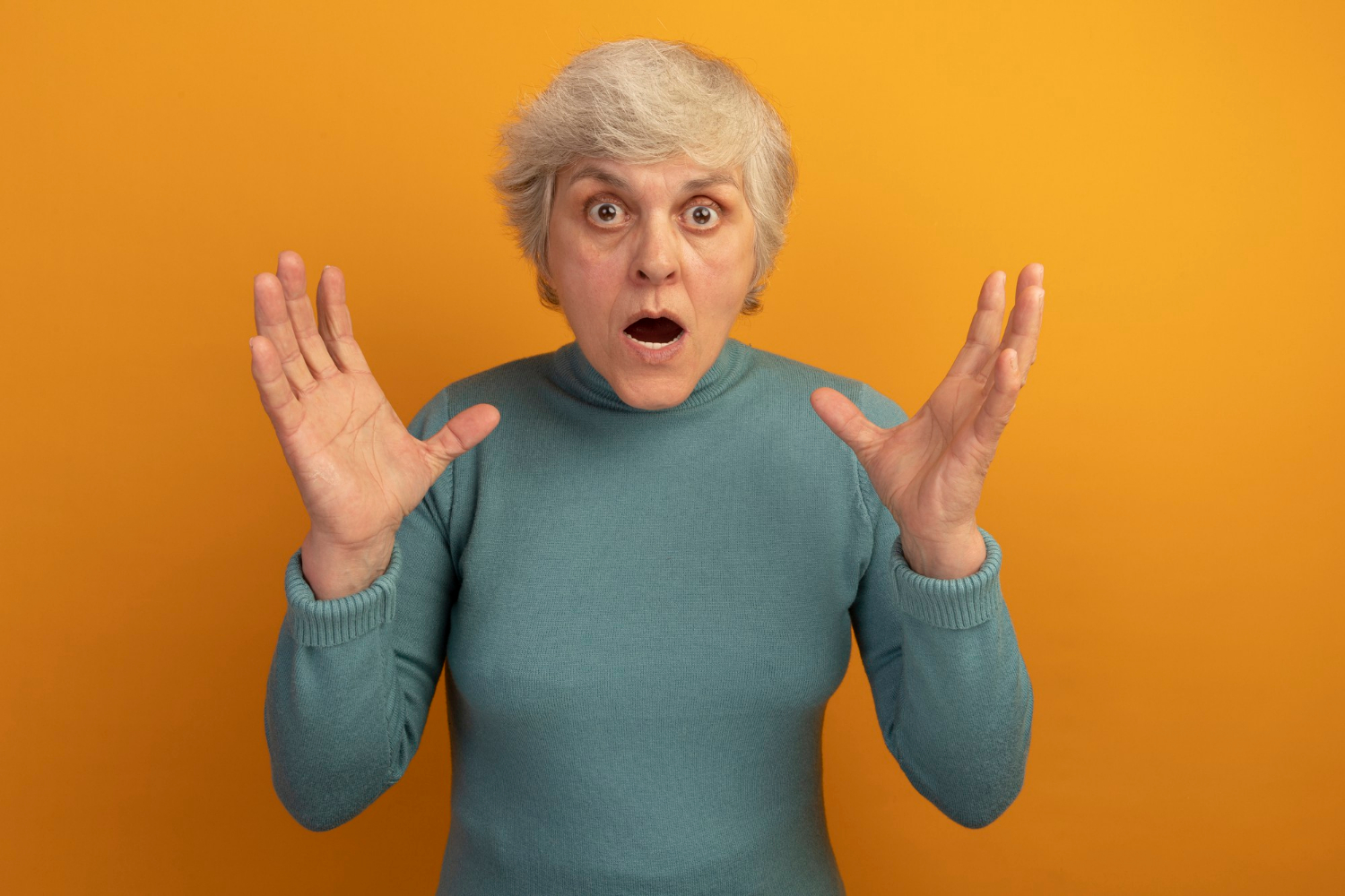 A shaken older woman | Source: Freepik