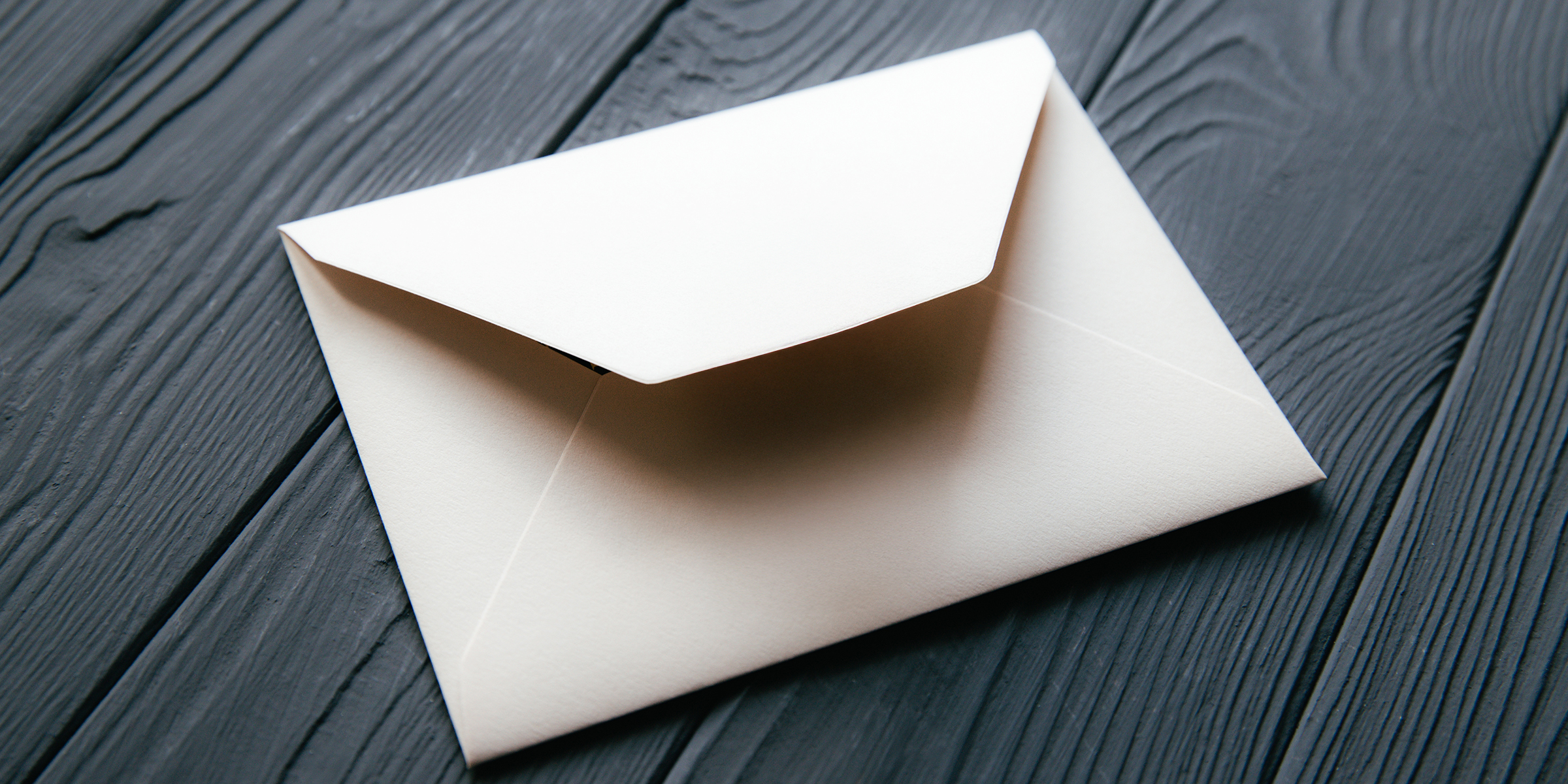 An envelope lying on a table | Source: Shutterstock