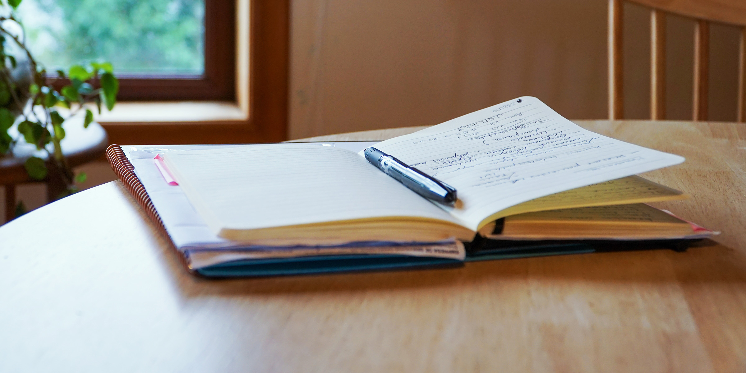 An open notebook on a table | Source: Shutterstock