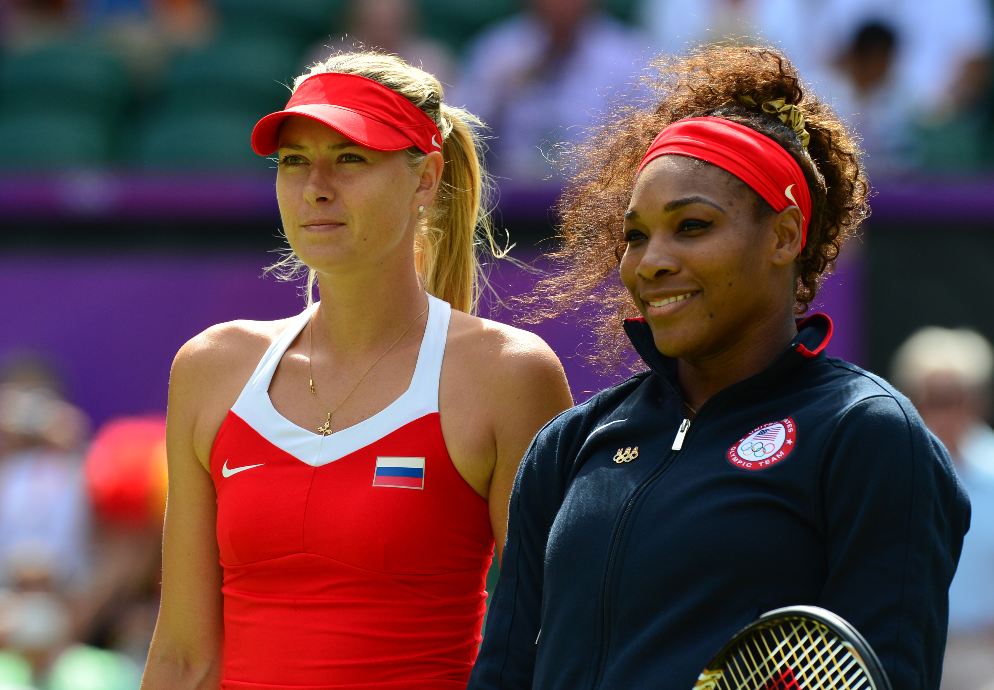 Russia's Maria Sharapova (L) and Serena Williams of the US pose prior to their final tennis match as part of the 2012 London Olympic Games at the All England Tennis Club in Wimbledon, southwest London, on August 3, 2012 | Source: Getty Images