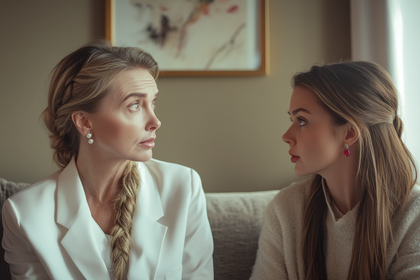 A mother and daughter having a serious talk on a couch | Source: Midjourney