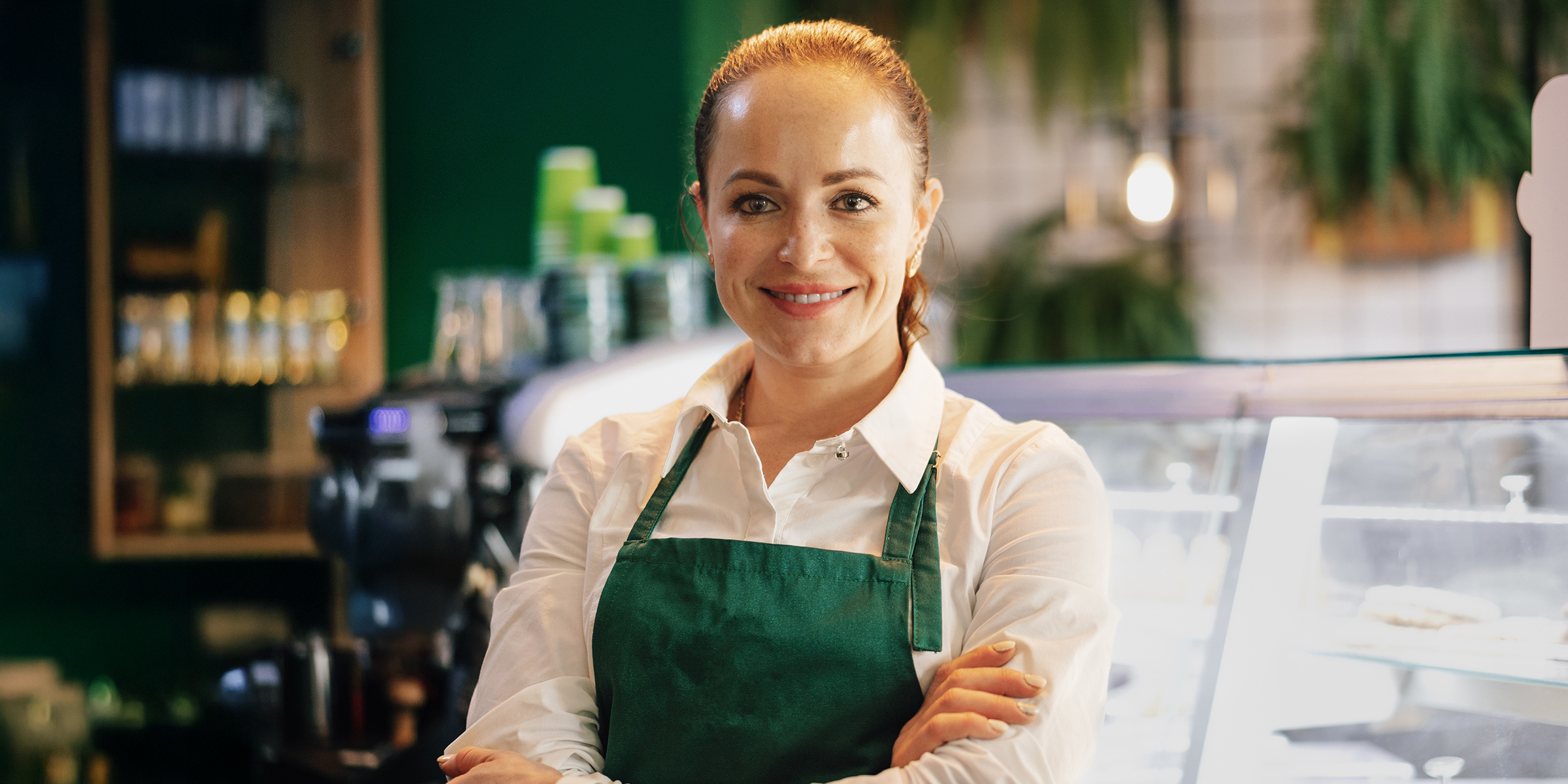 A woman in a barista uniform | Source: Shutterstock