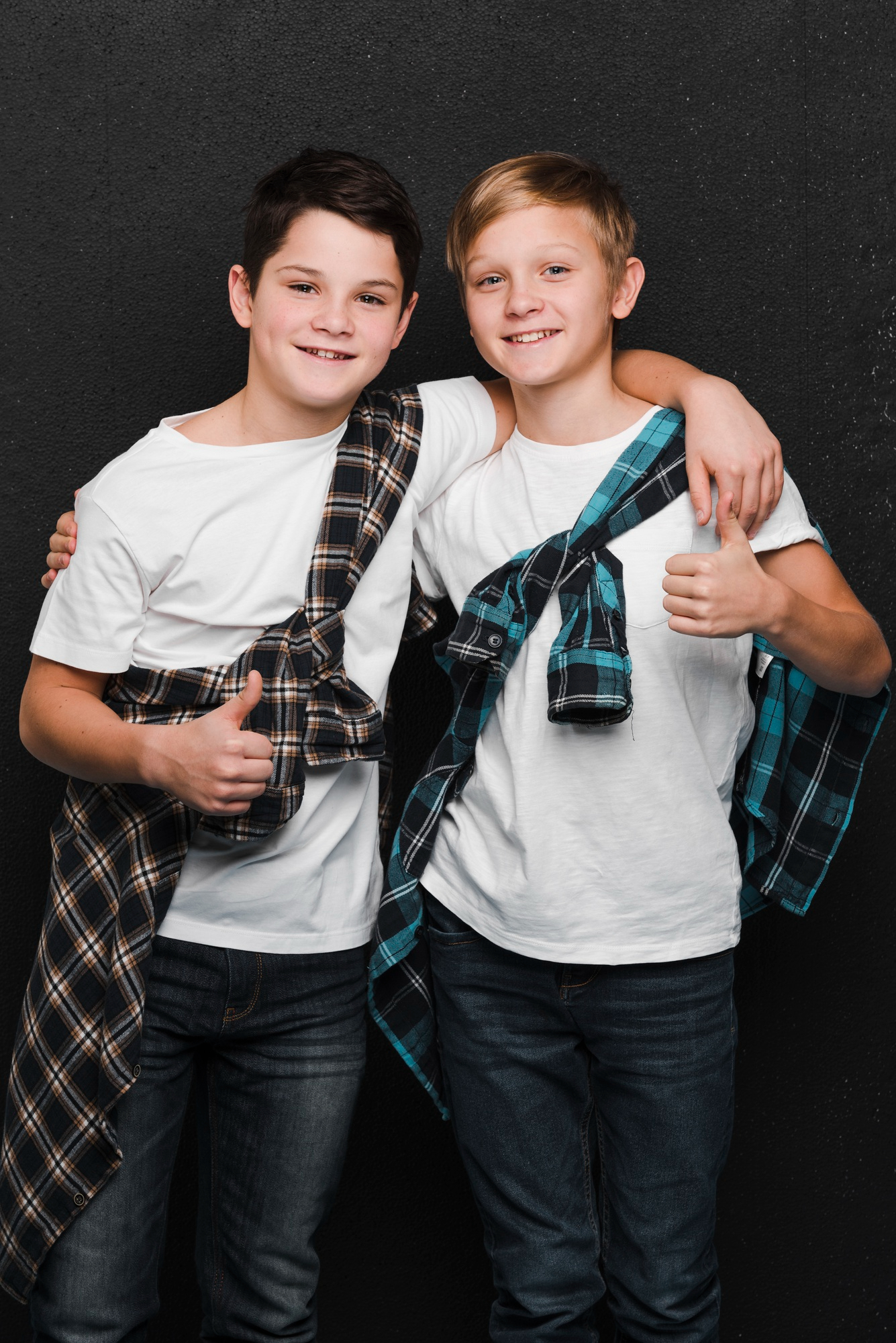 Two young boys smiling | Source: Freepik