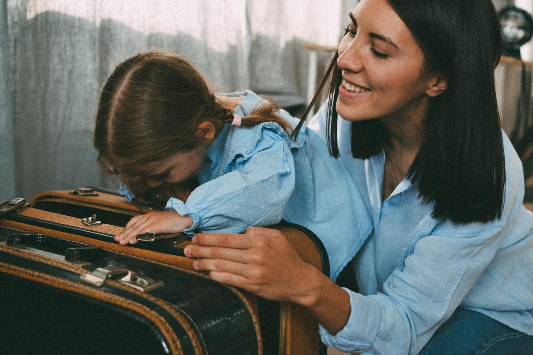 A woman packing together with her daughter | Source: Pexels