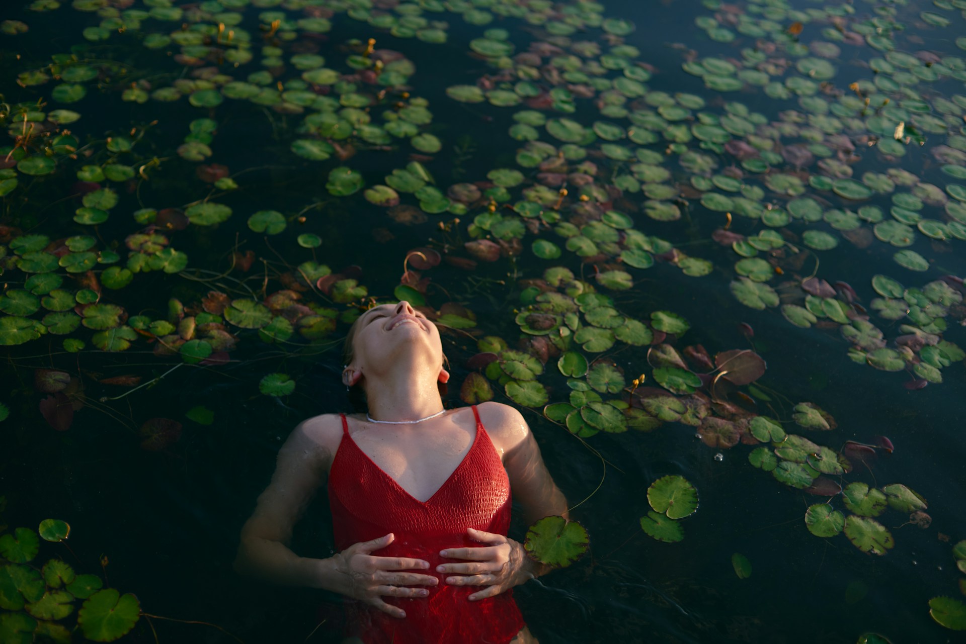 Someone swimming in a lake | Source: Unsplash