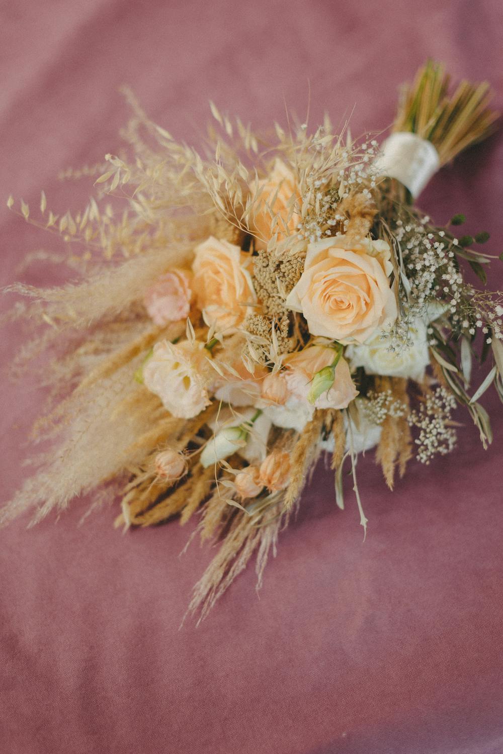 A wedding bouquet on fabric | Source: Pexels