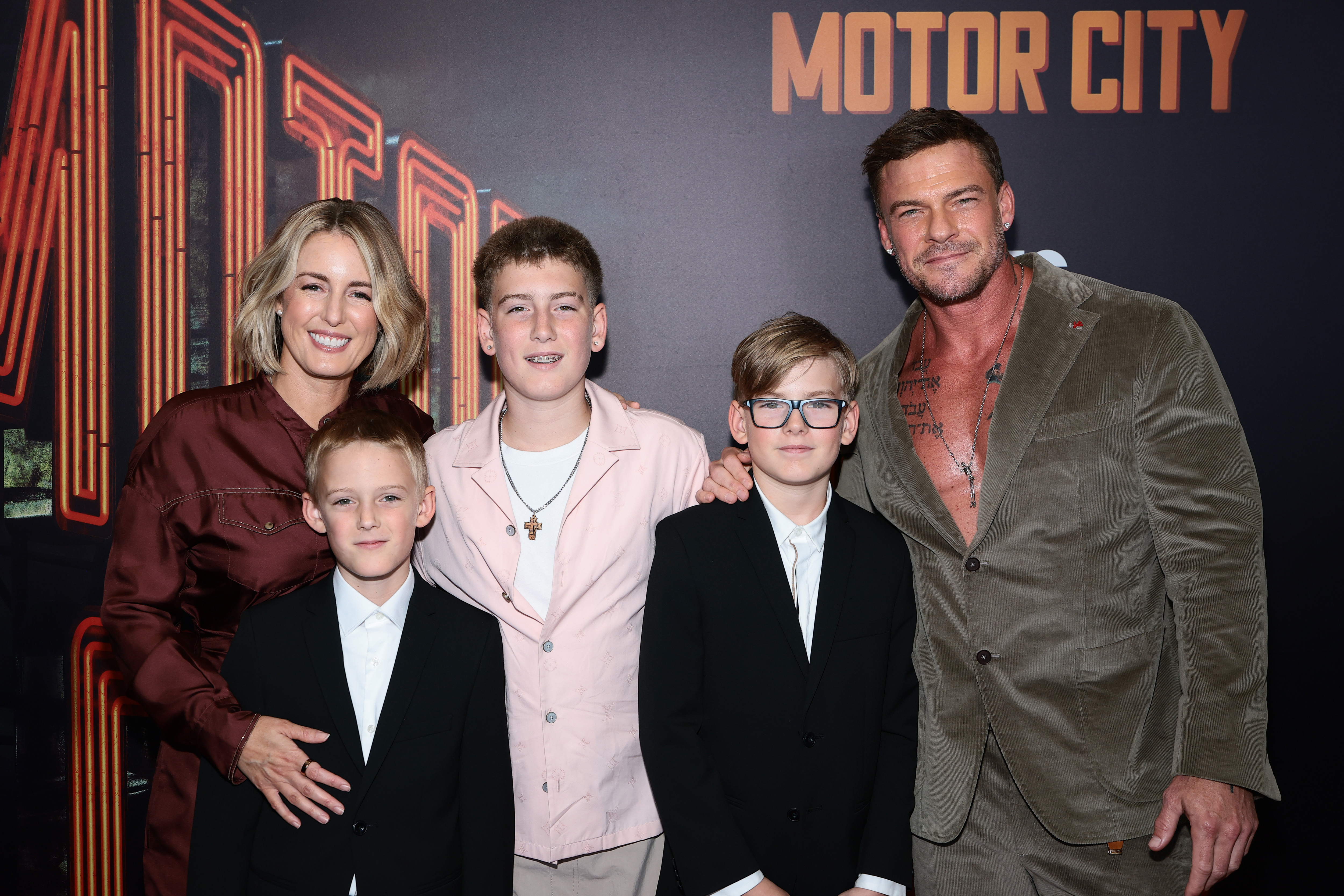 Catherine Ritchson and Alan Ritchson pose with their children at the premiere of "Motor City" at Museum of Modern Art on July 13, 2026 in New York City. | Source: Getty Images