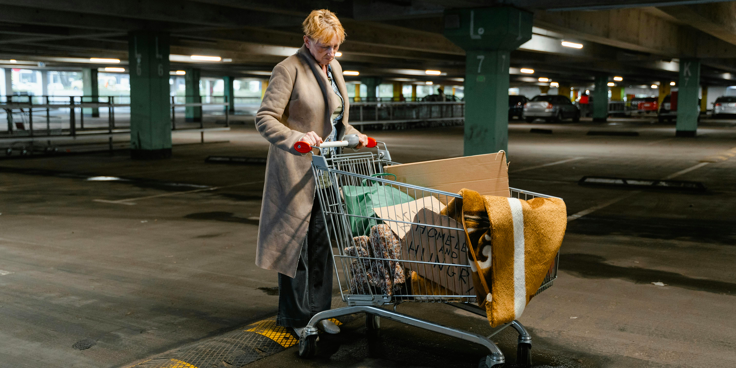 Homeless woman pushing a grocery cart | Source: Pexels